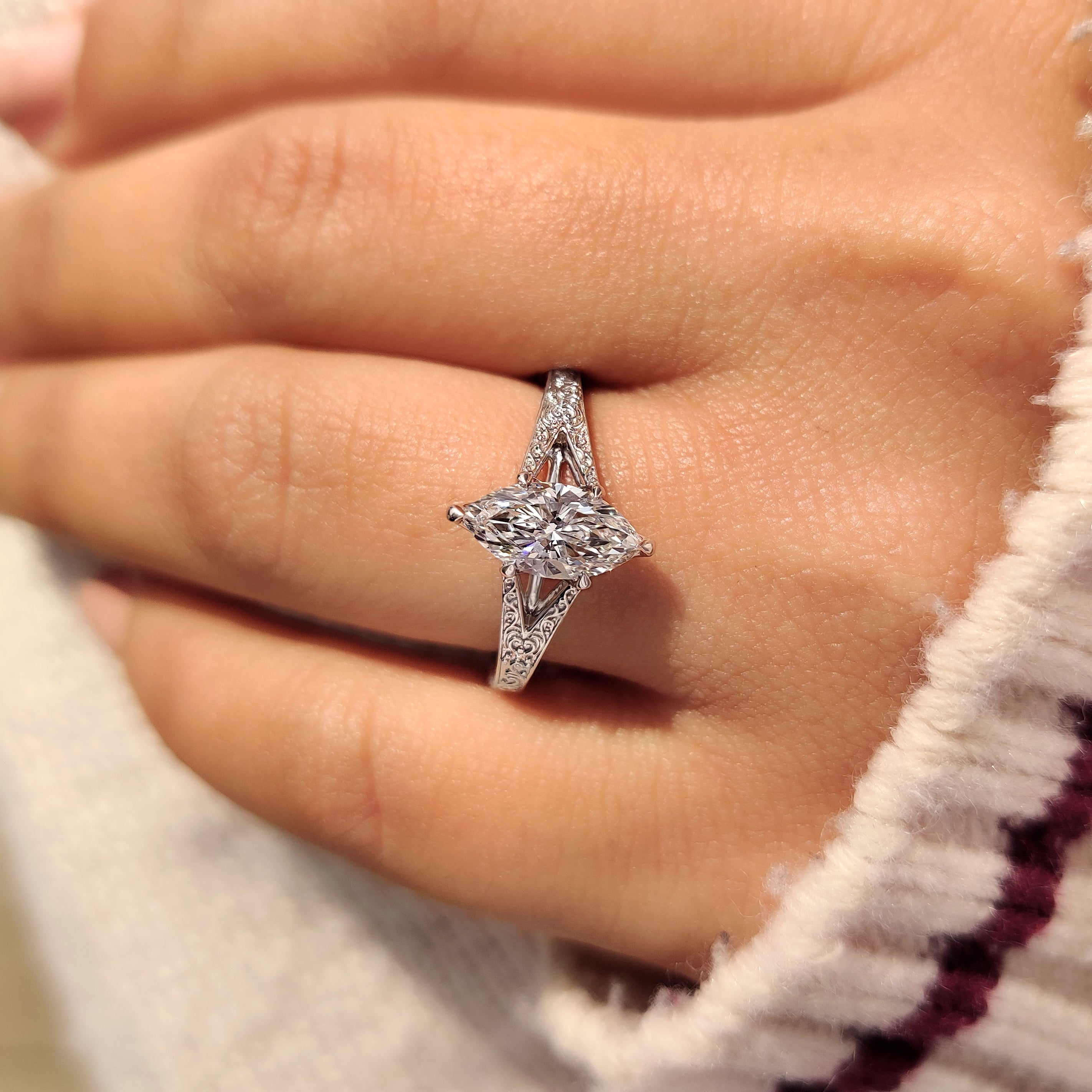 Marquise cut engagement ring with vintage inspired split shank.
