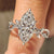 Marquise cut lab grown diamond ring with side stones.
