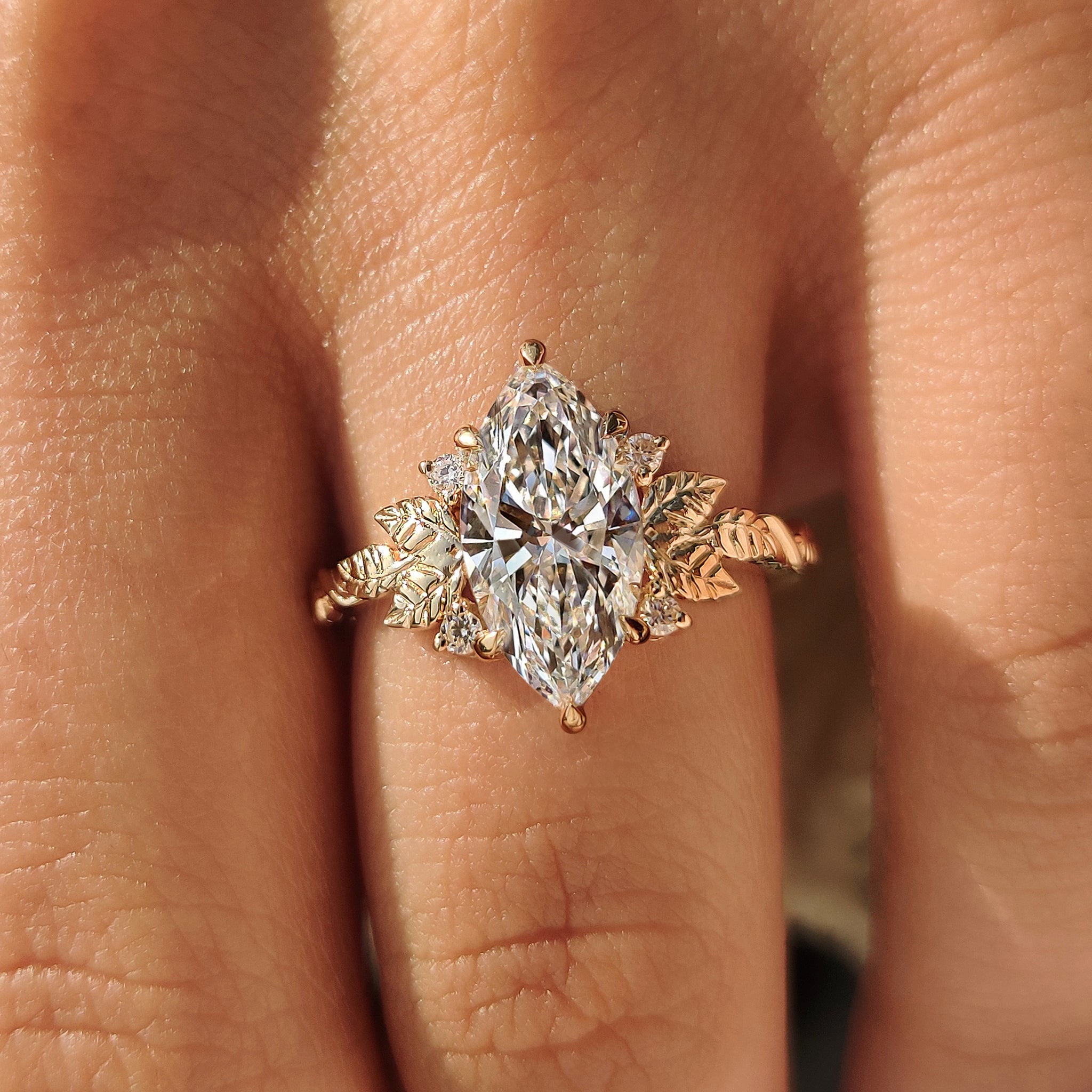 Lab grown marquise diamond ring with secure basket setting.
