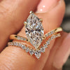 Marquise diamond ring with v shape wedding band.