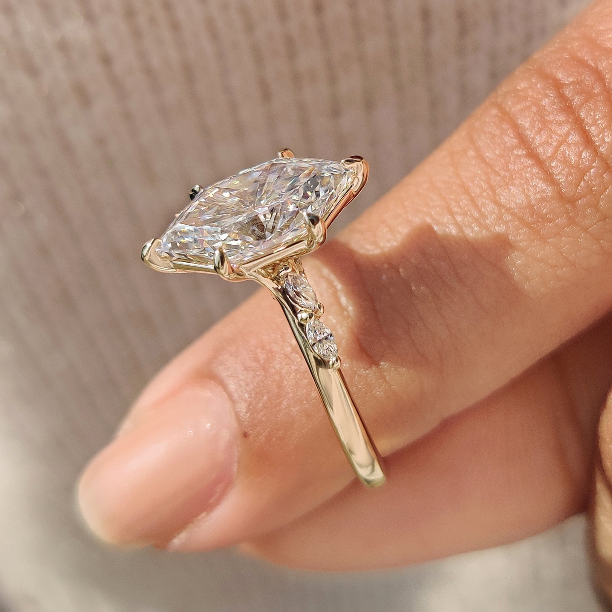 Dutch marquise cut ring with detailed bridge accent.
