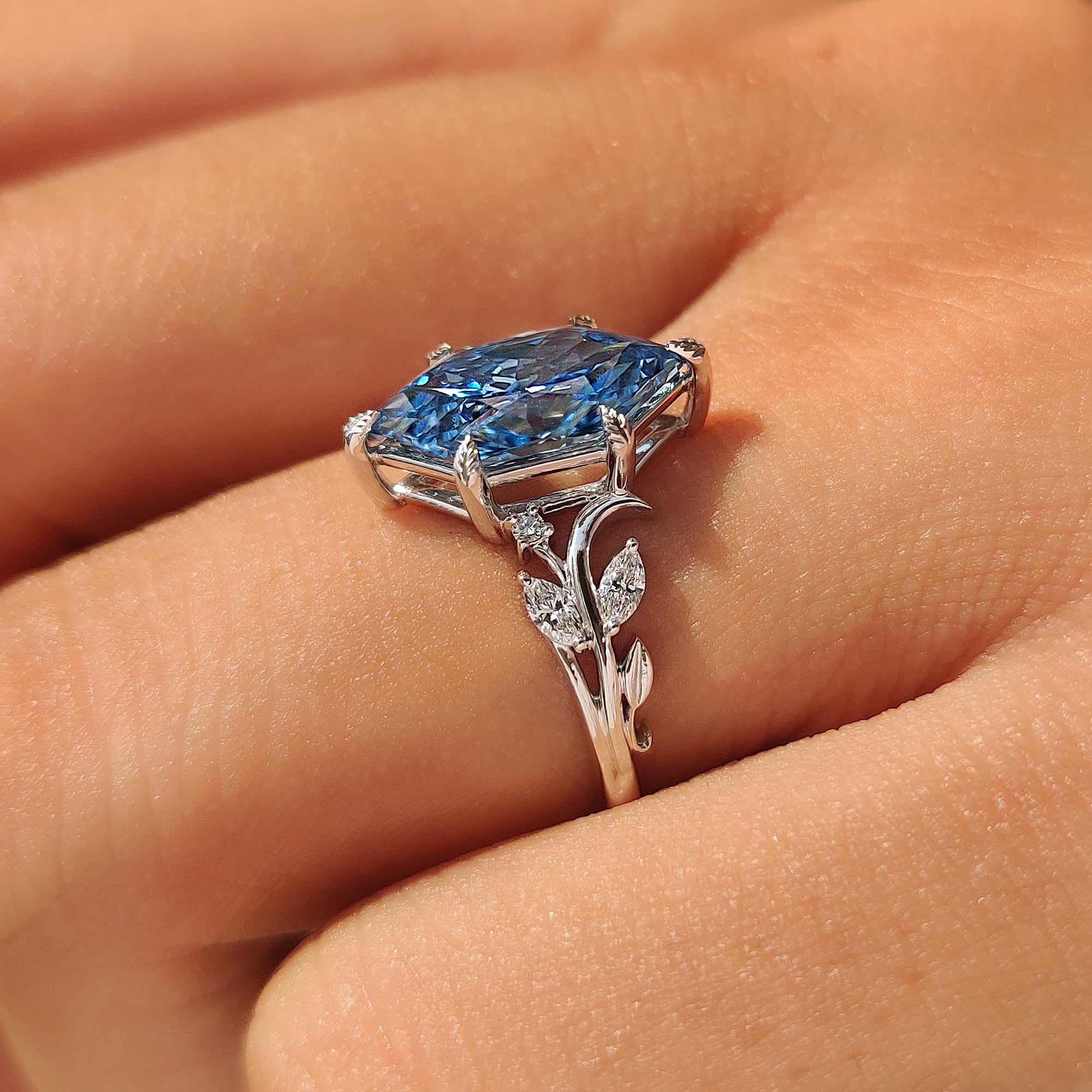 Side view of an open gallery basket on nature inspired ring.
