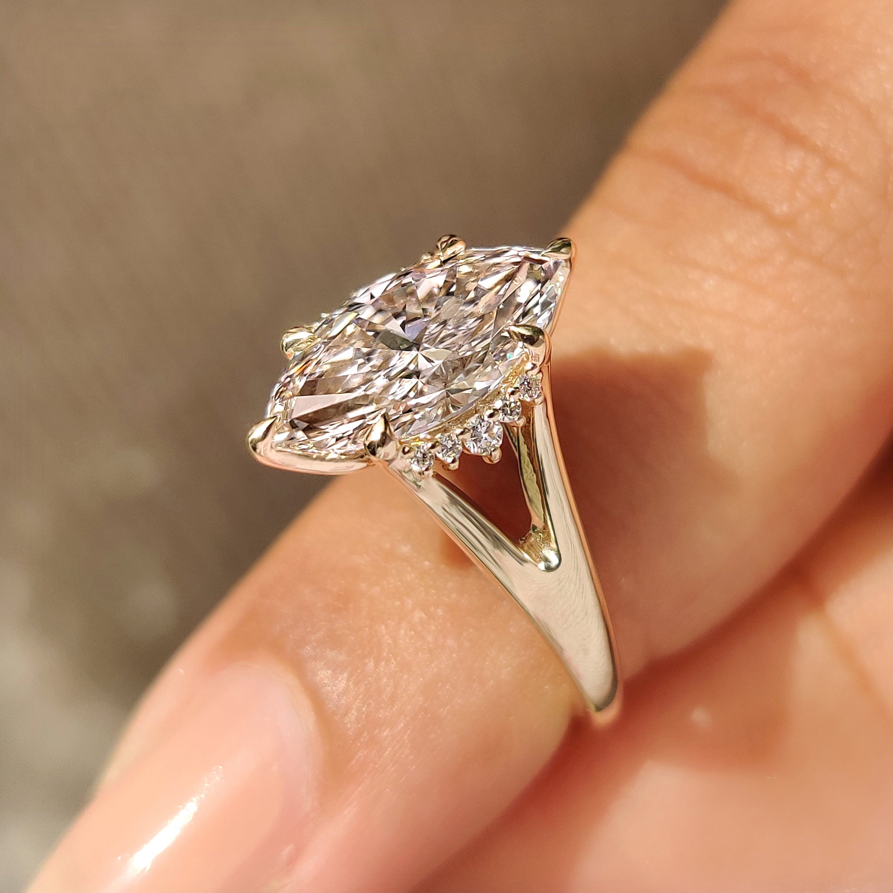 Marquise diamond ring with tulip setting and split shank
