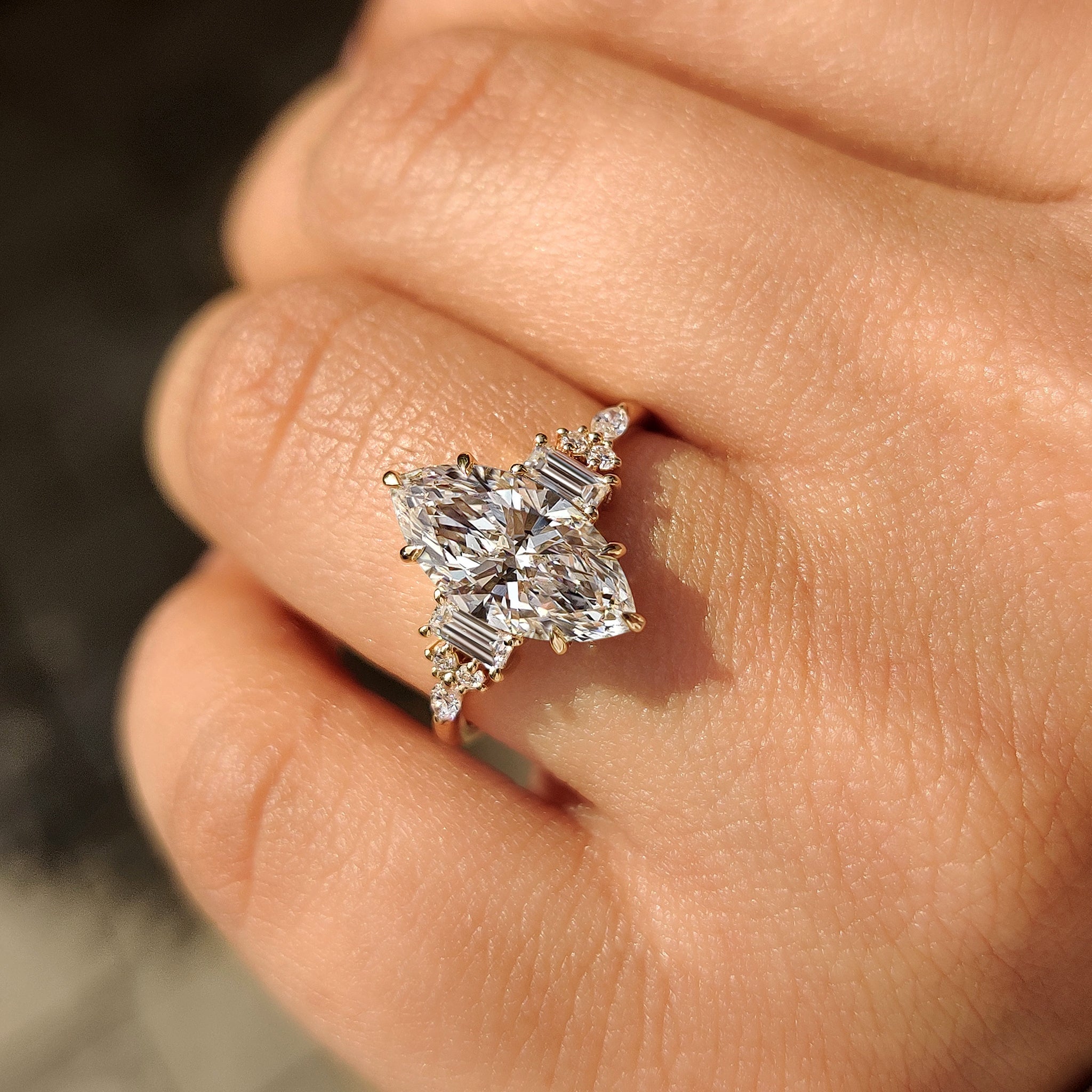 Handmade marquise engagement ring with six claw prong.
