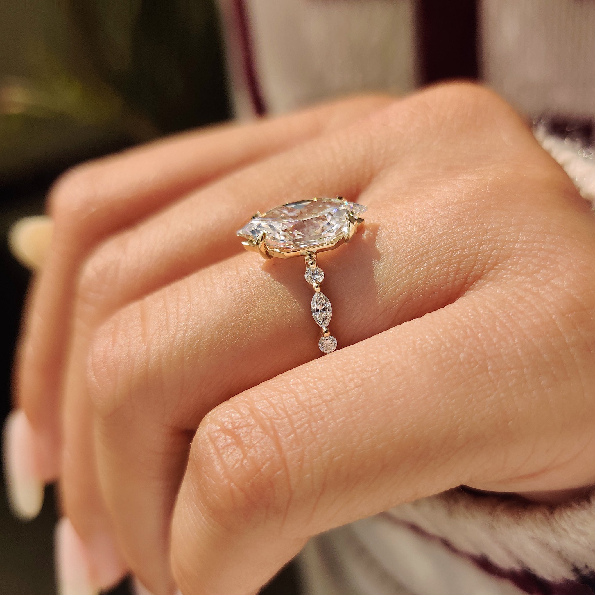 Handmade dutch marquise engagement ring with round pave band.
