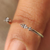 Marquise and round diamond band in open gap style.
