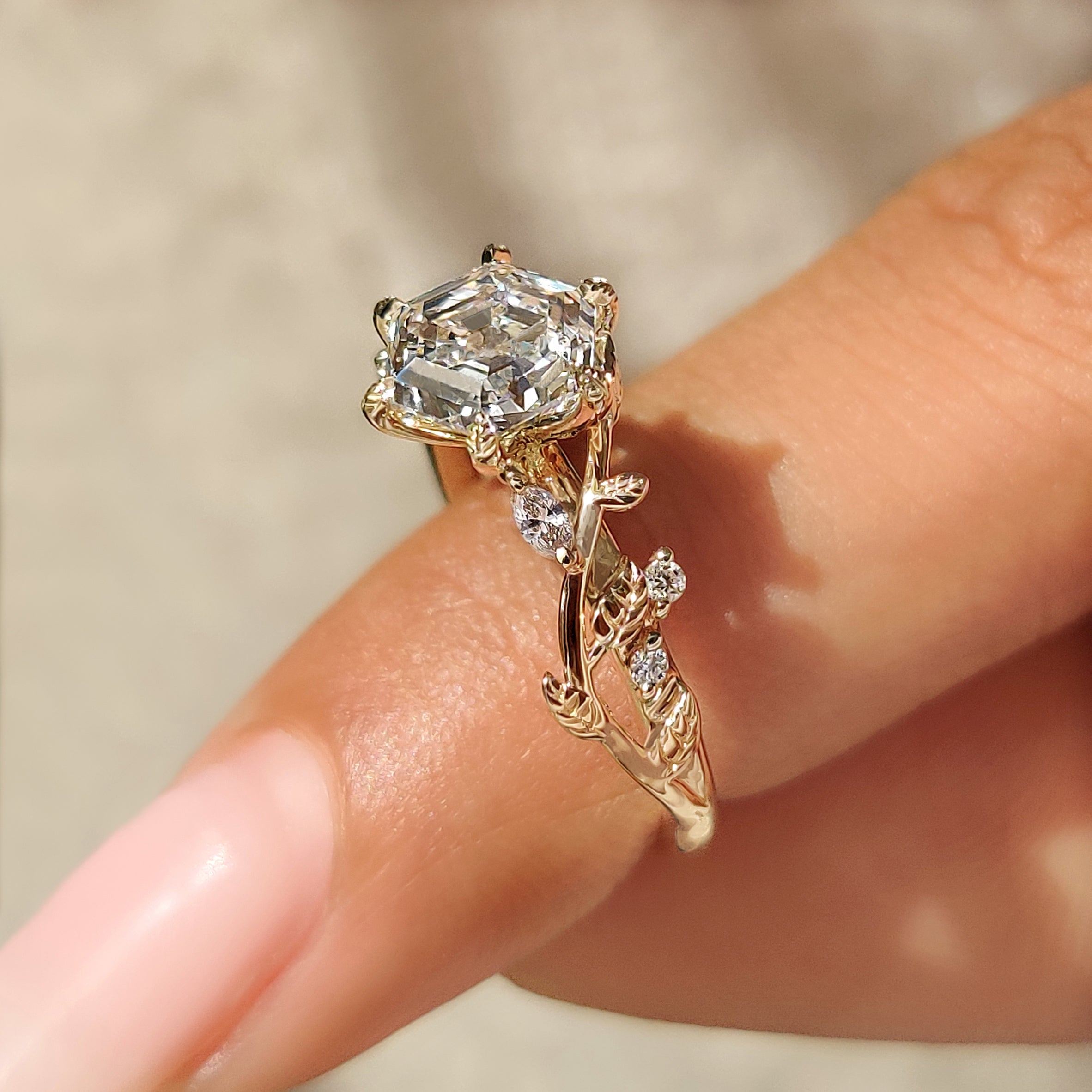Hexagon cut diamond ring with six leaf style prongs
