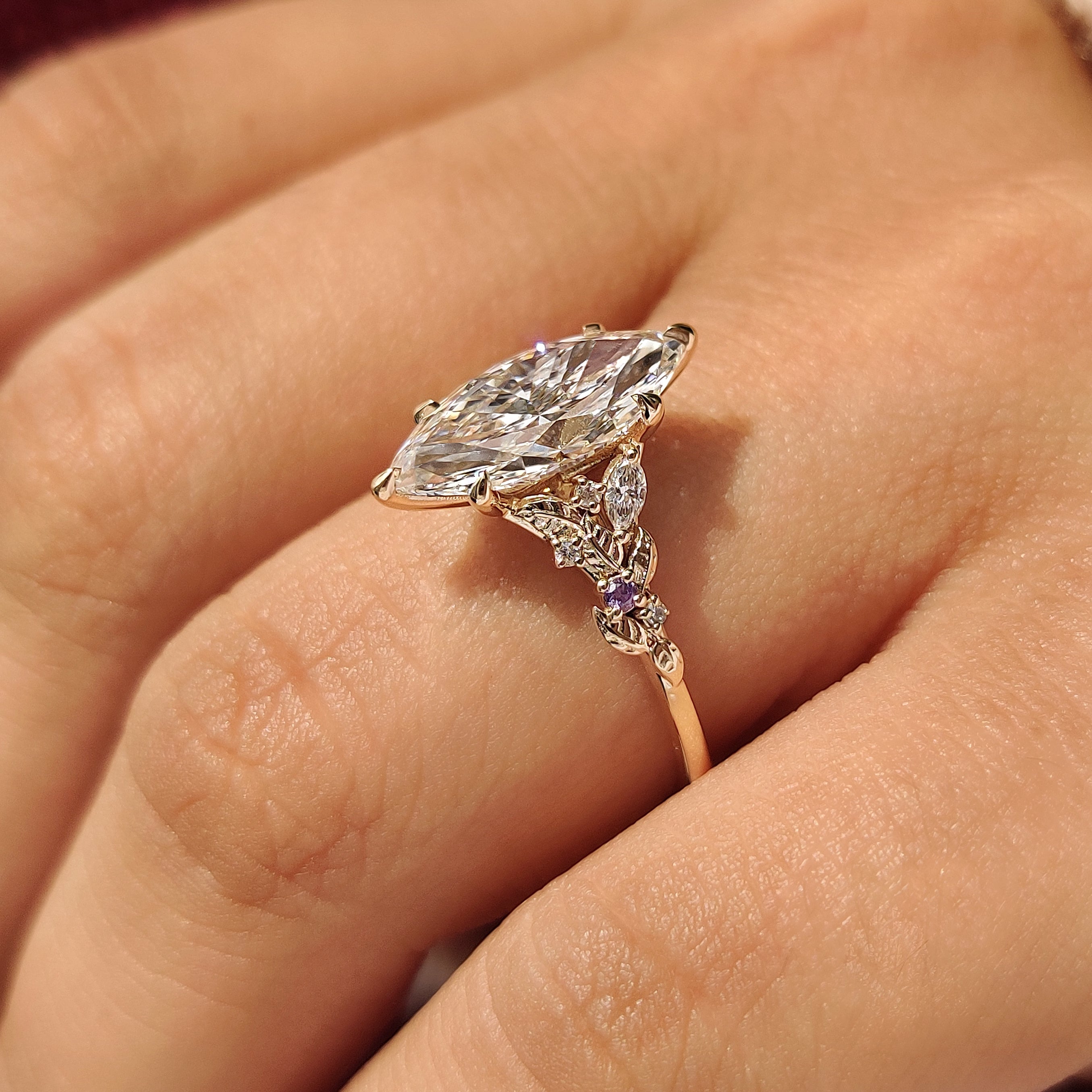 Marquise lab grown diamond ring with amethyst side stones
