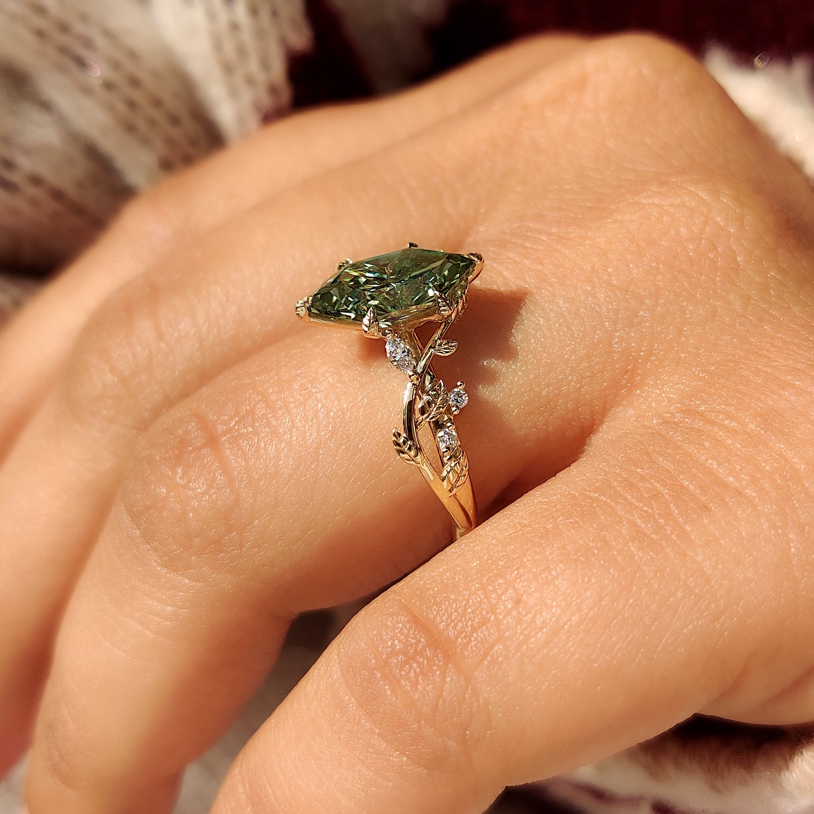 Cluster style diamond ring with six leaf prong setting

