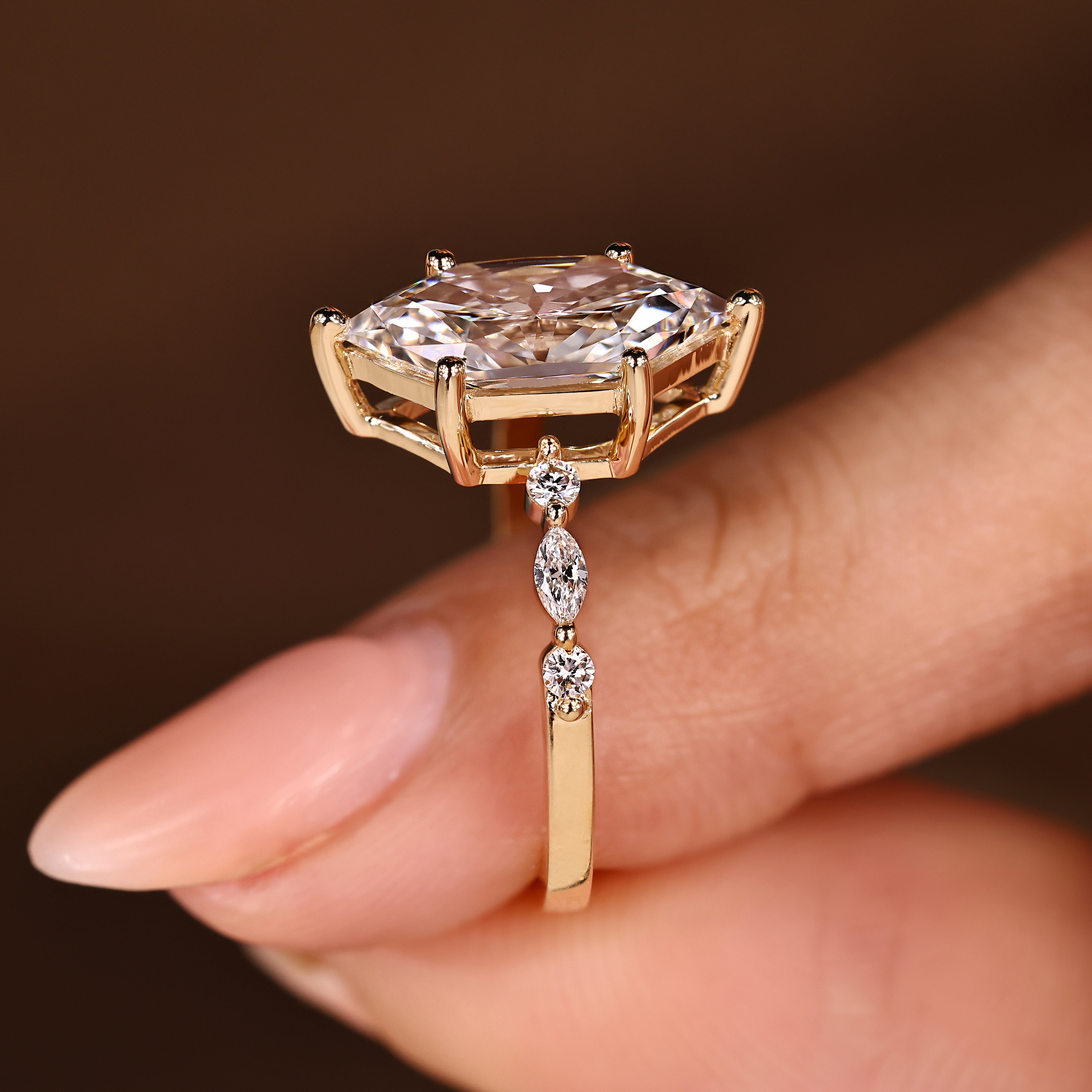 Dutch marquise ring with marquise and round accent stones
