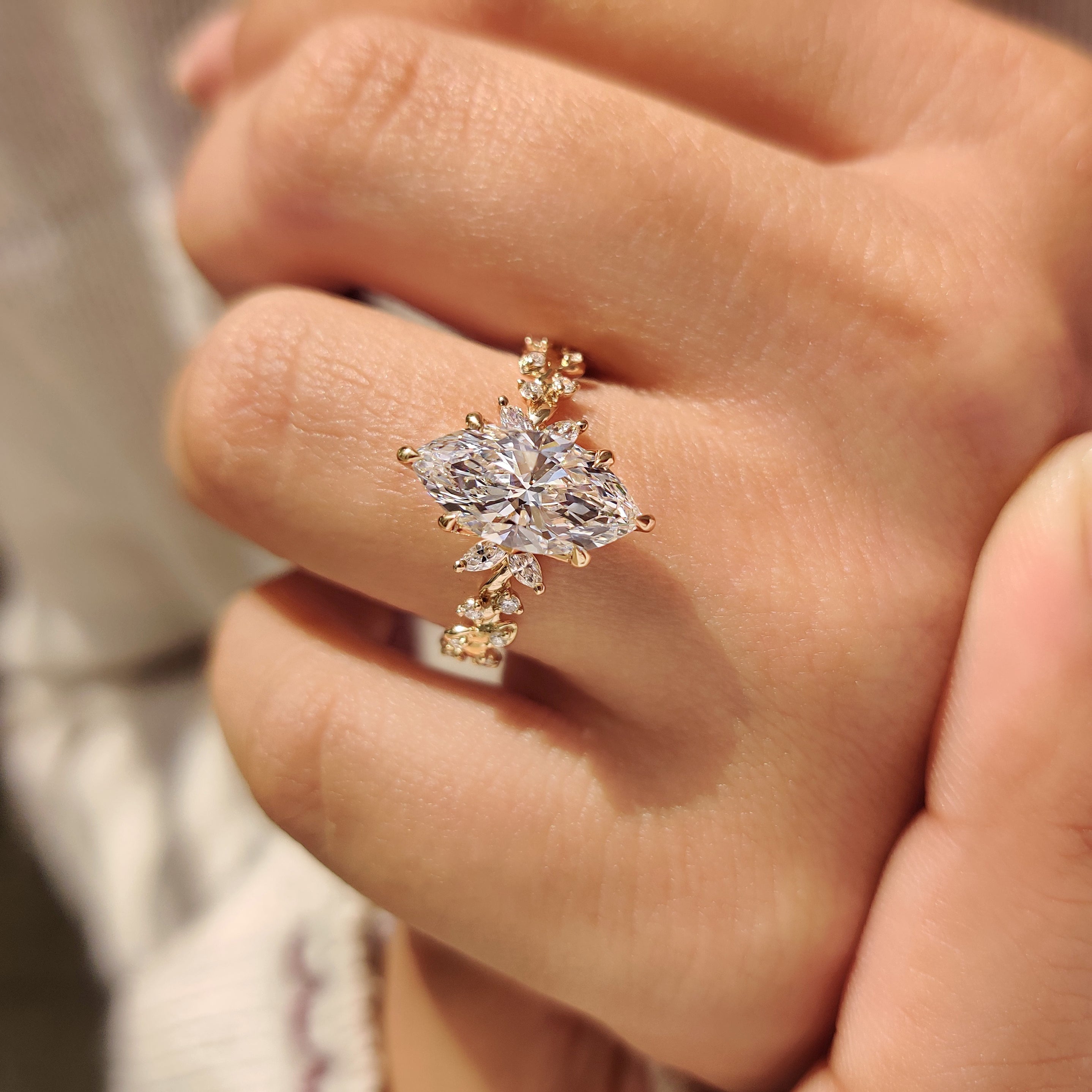 Marquise diamond ring with round and marquise side stones.
