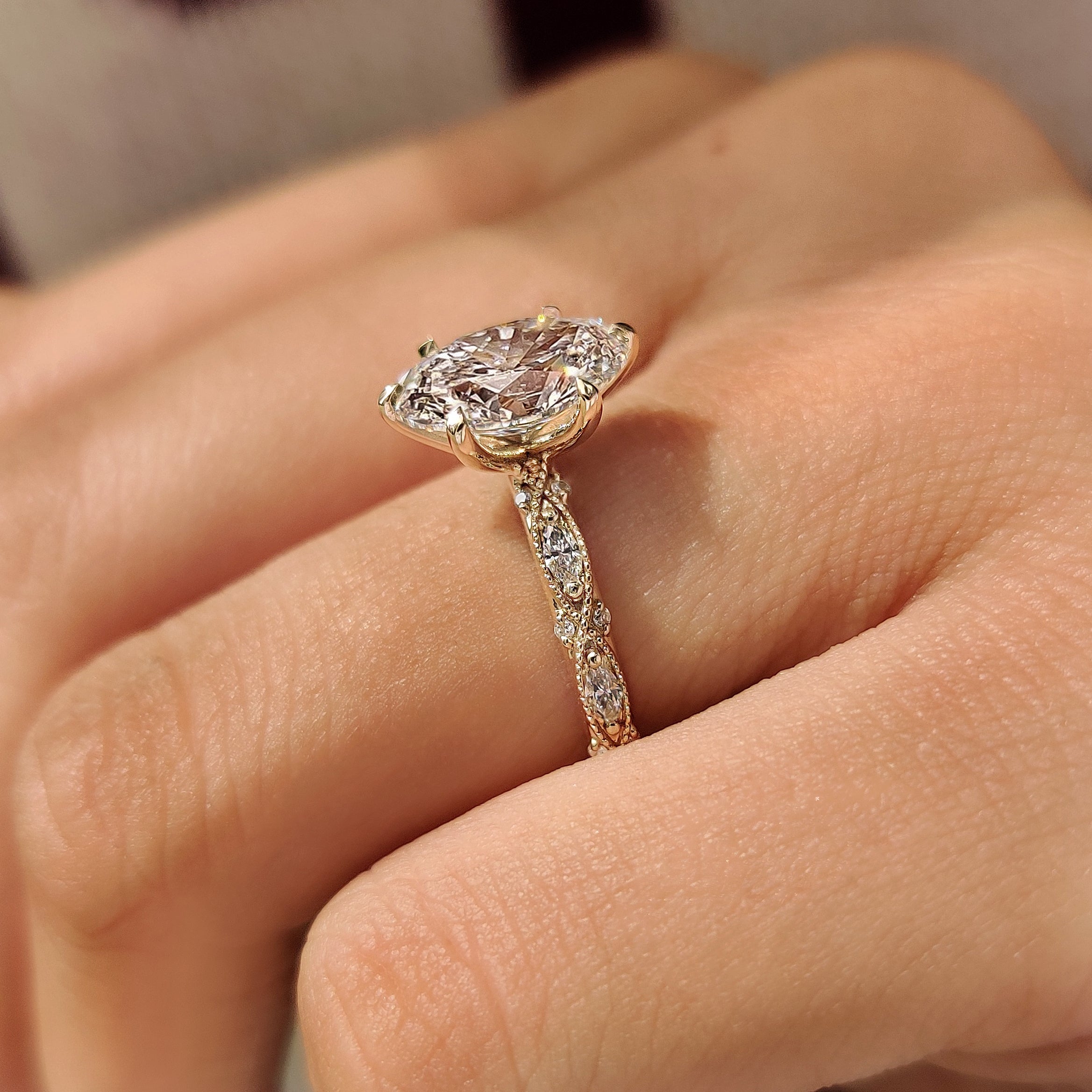 IGI certified oval center diamond with vintage milgrain
