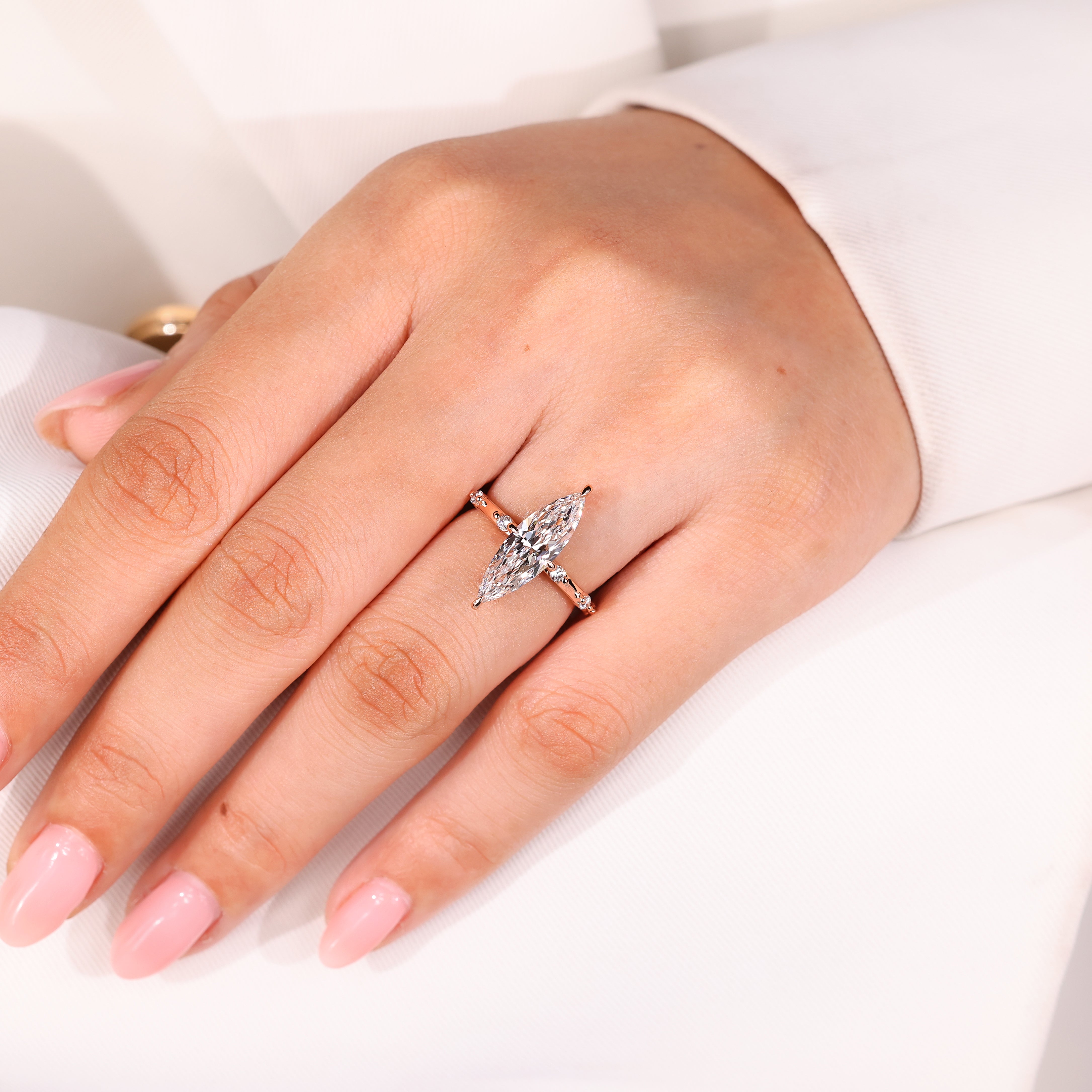 Marquise diamond ring with seven stone style design
