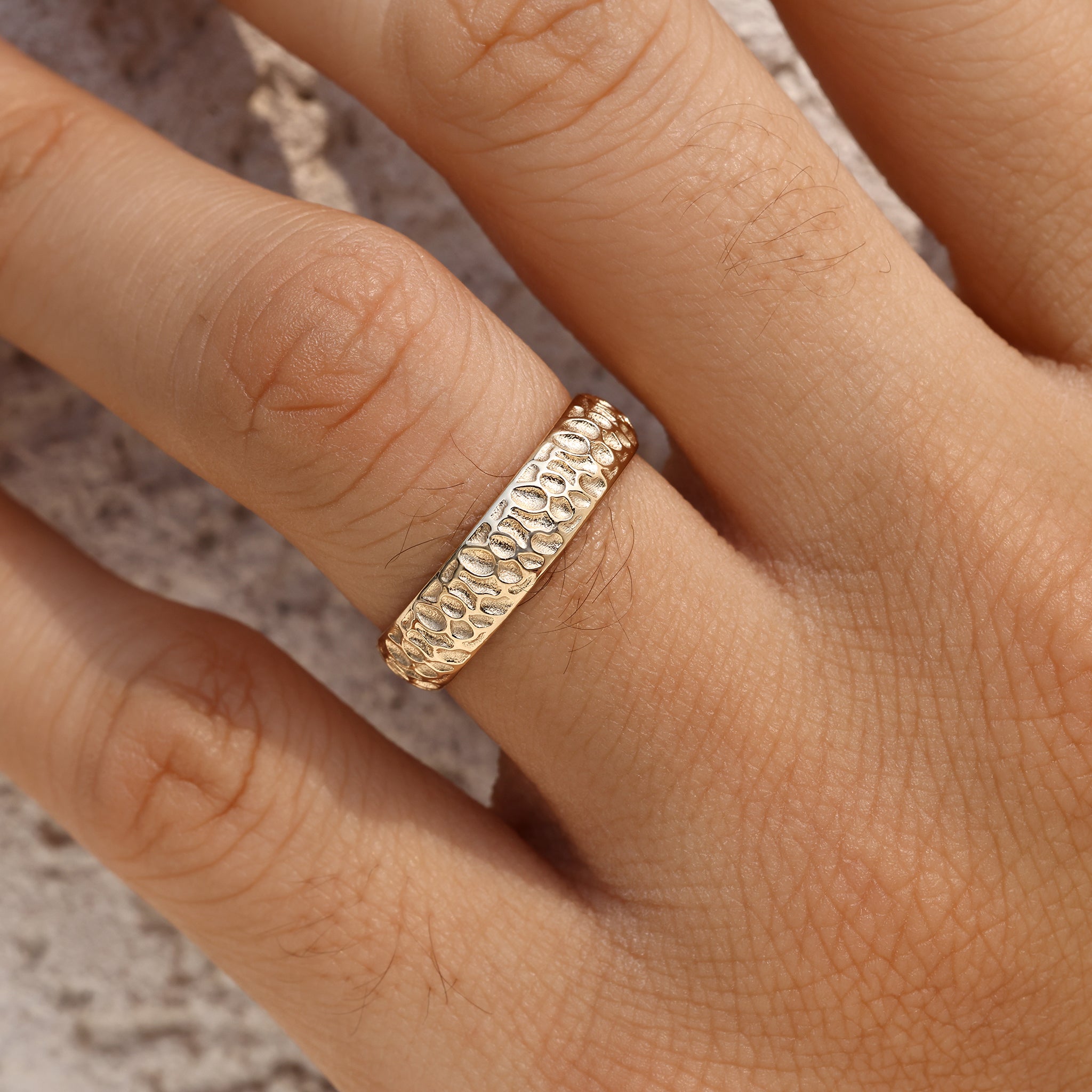 Men's engagement ring featuring hammer finish design
