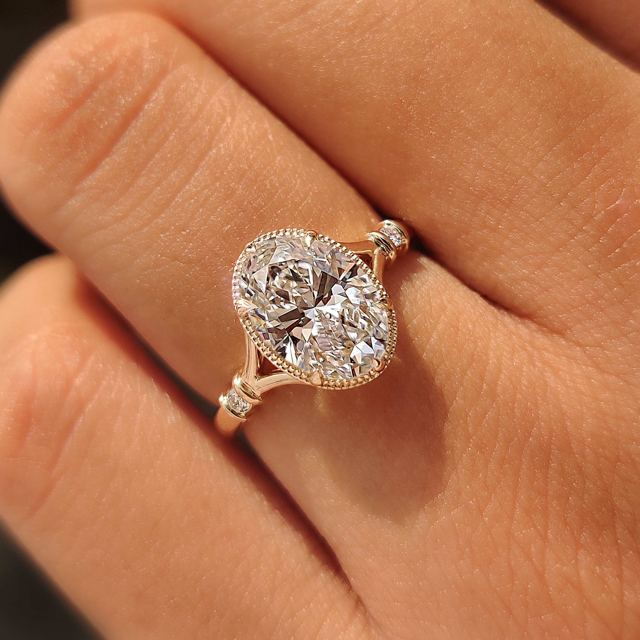 IGI certified 2.00 carat oval diamond ring with round side stones.
