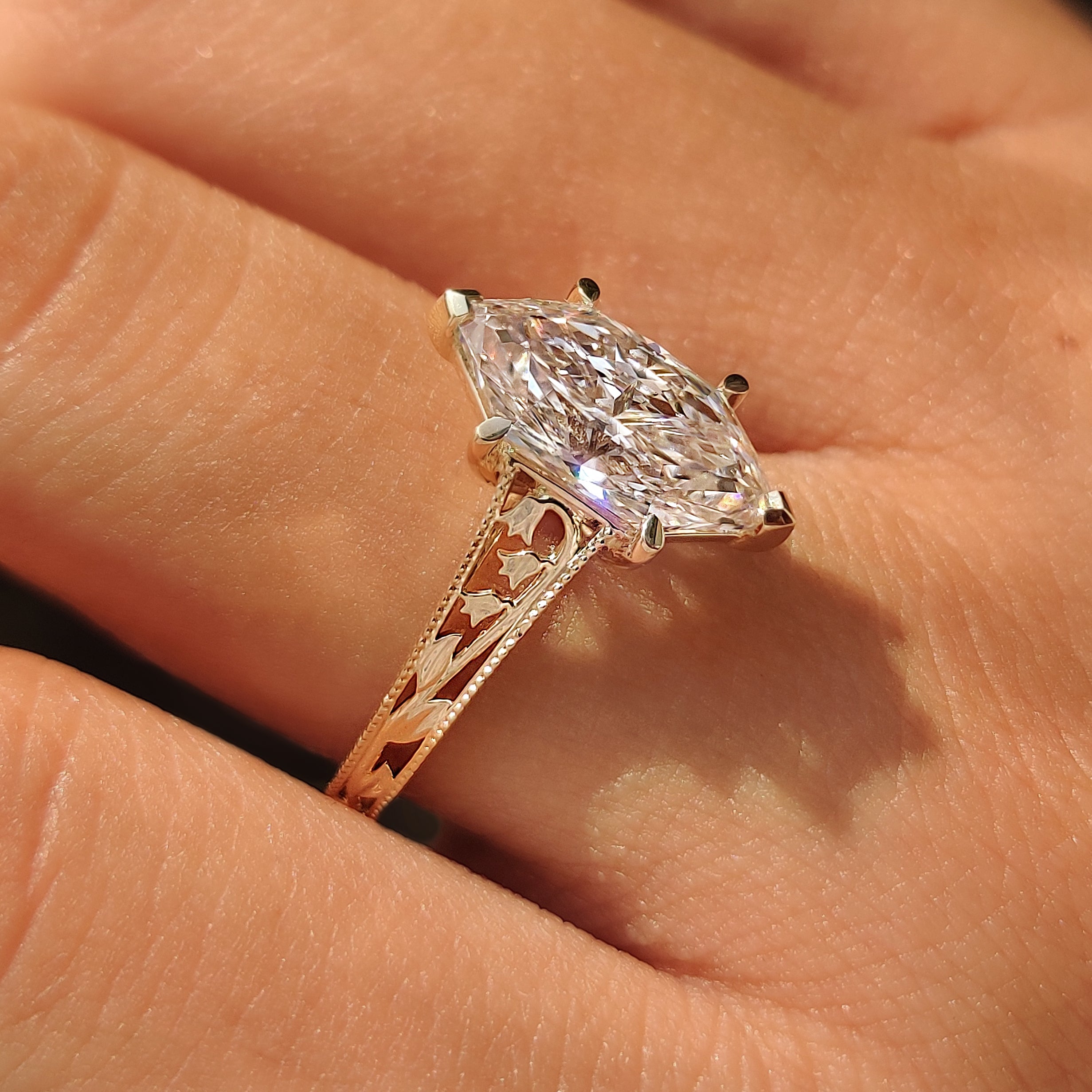 Dutch marquise solitaire ring with cathedral setting.
