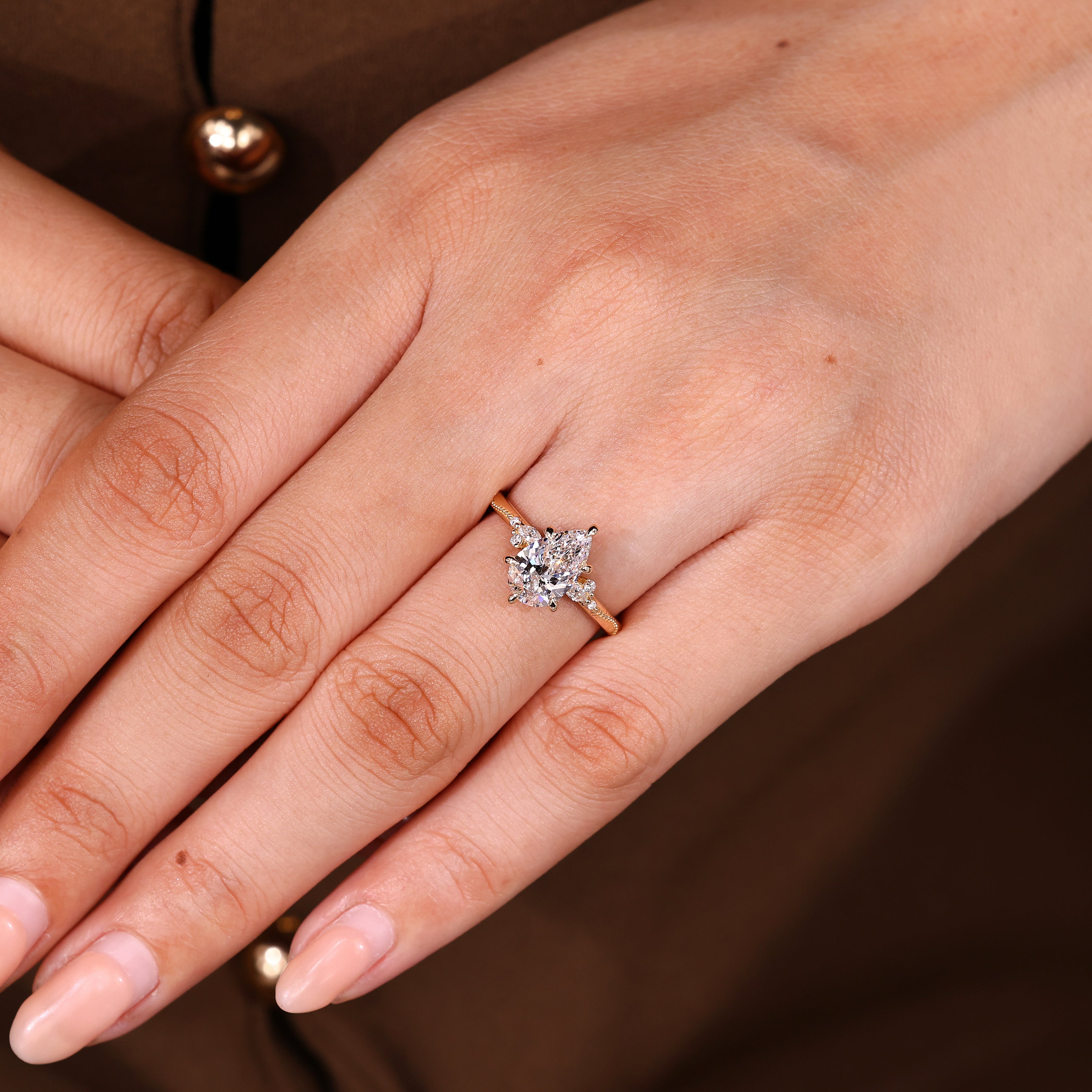 Lab grown pear ring with marquise and round stones
