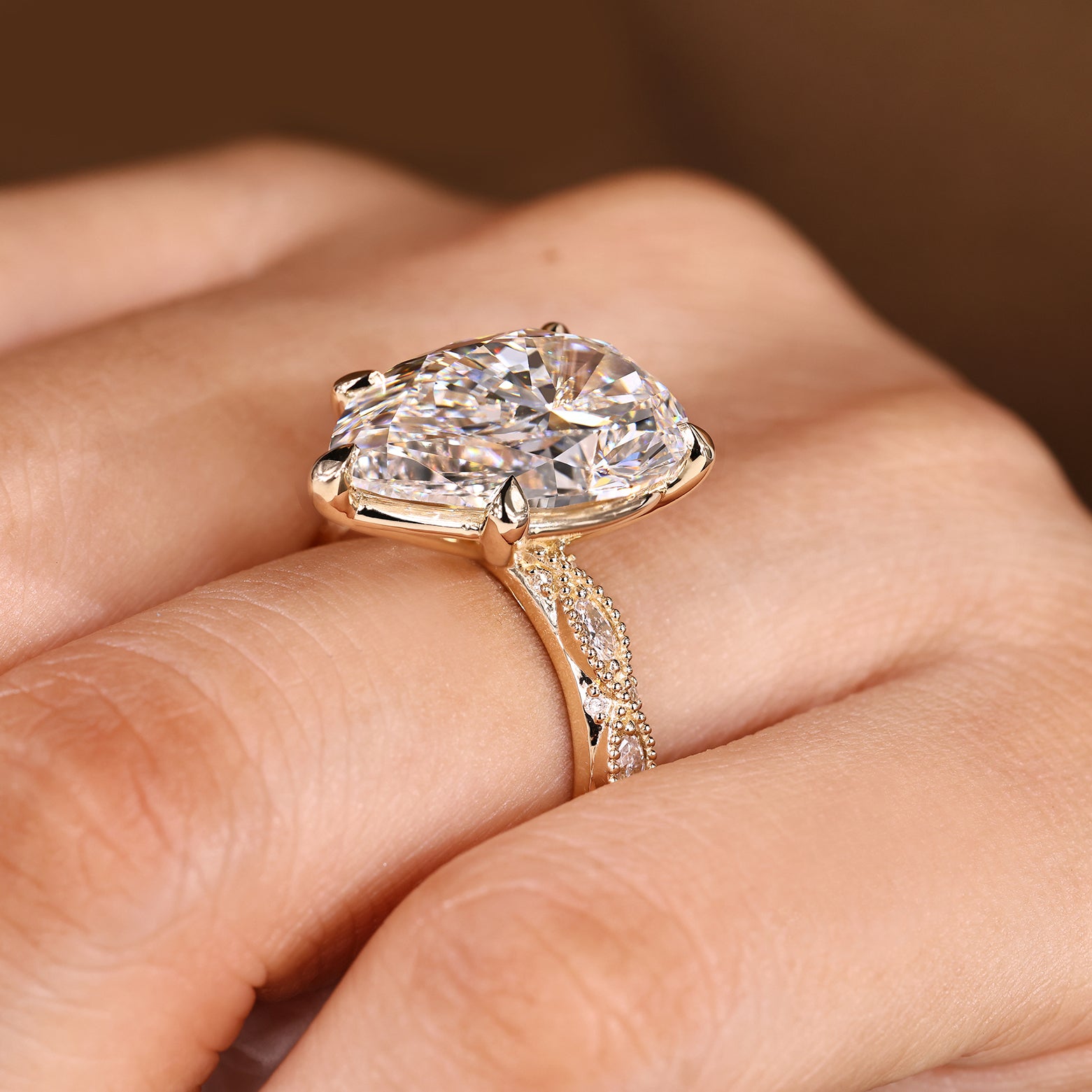 10 carat pear cut center diamond in vintage inspired ring
