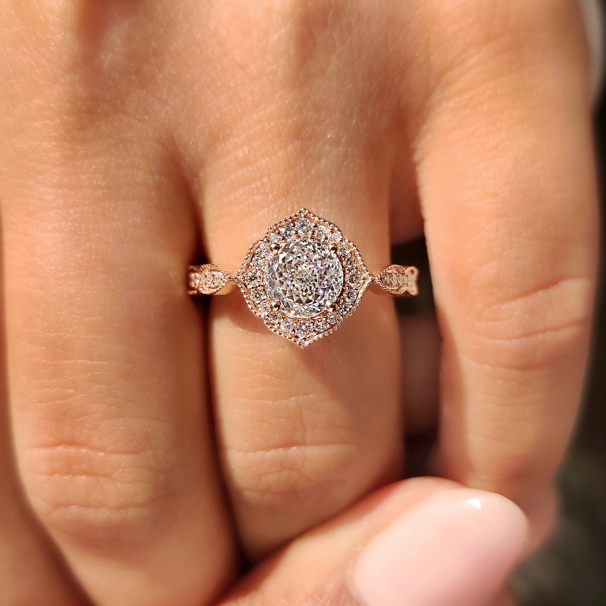 Four prong Portuguese diamond ring with elegant milgrain finish.

