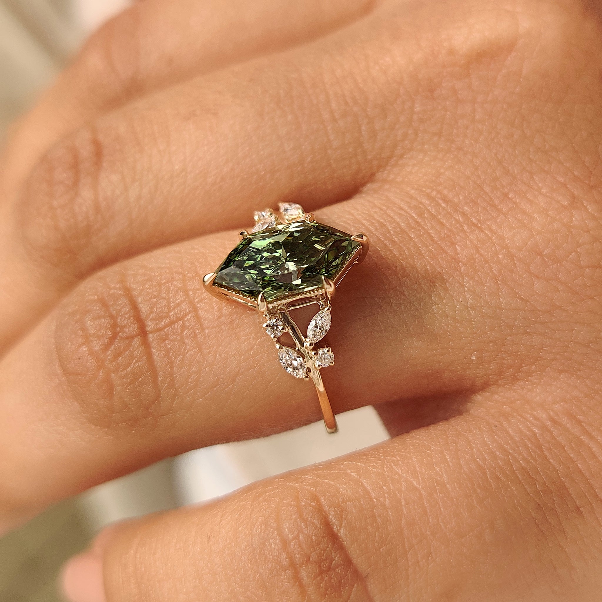 Lab grown green diamond engagement ring in cluster style.
