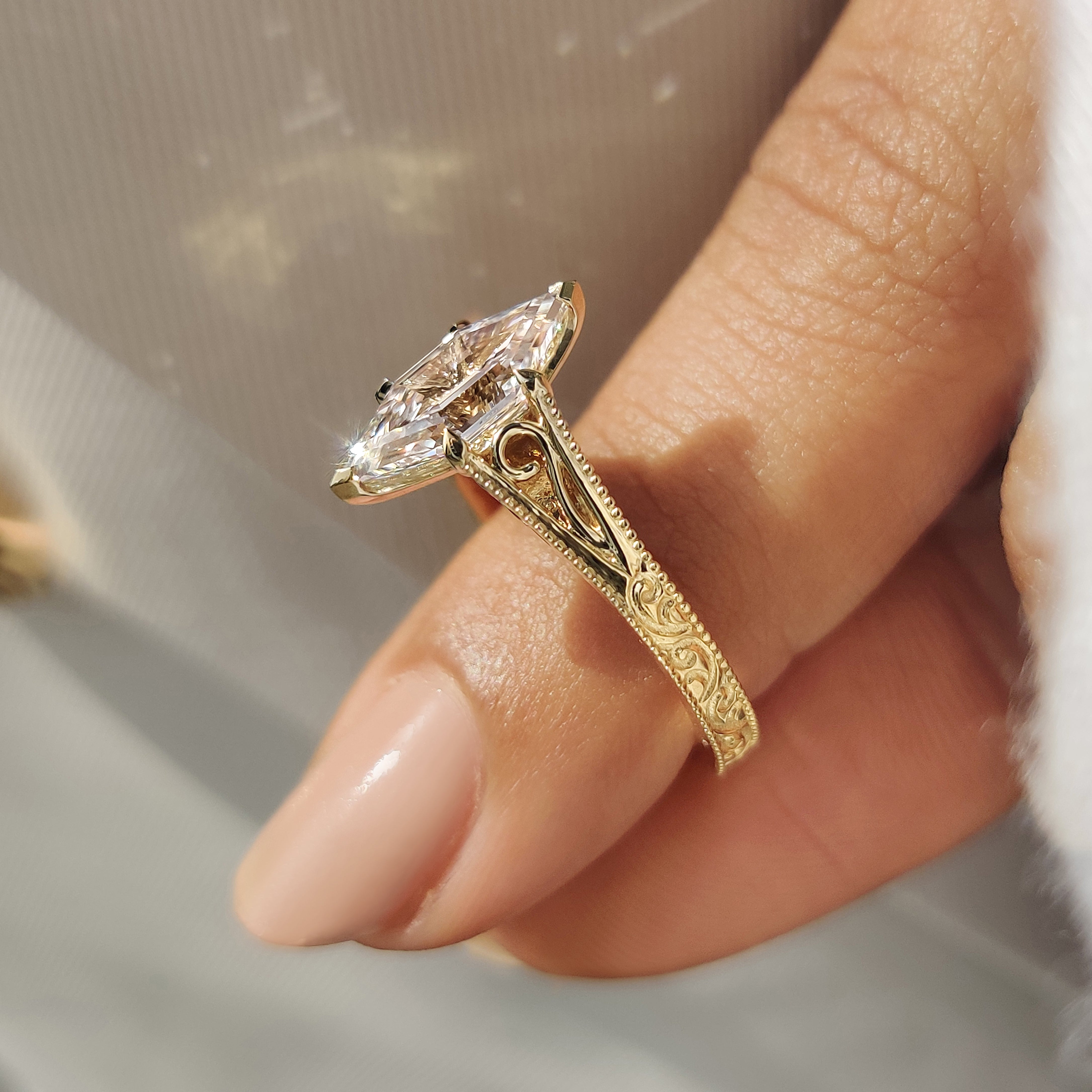 Vintage style hexagon diamond ring with detailed milgrain finish
