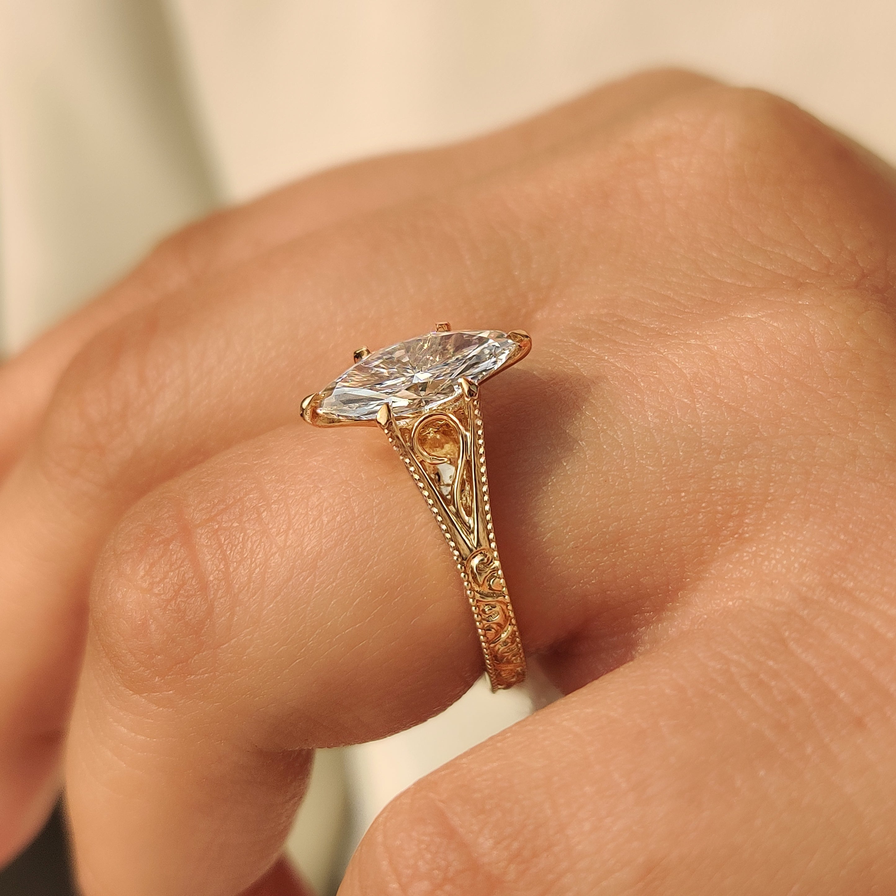Art deco marquise diamond ring with vintage inspired detailing.
