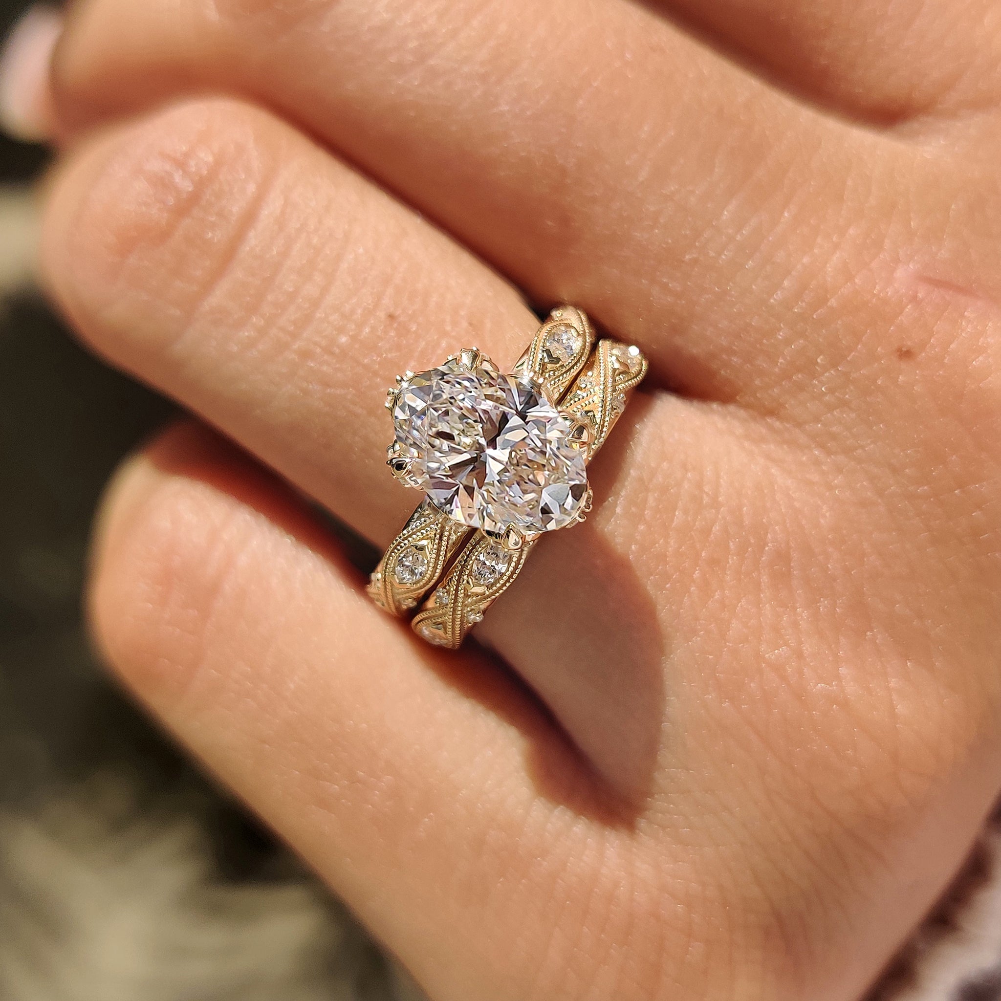 Handmade oval cut ring with hidden accents and eternity band set.
