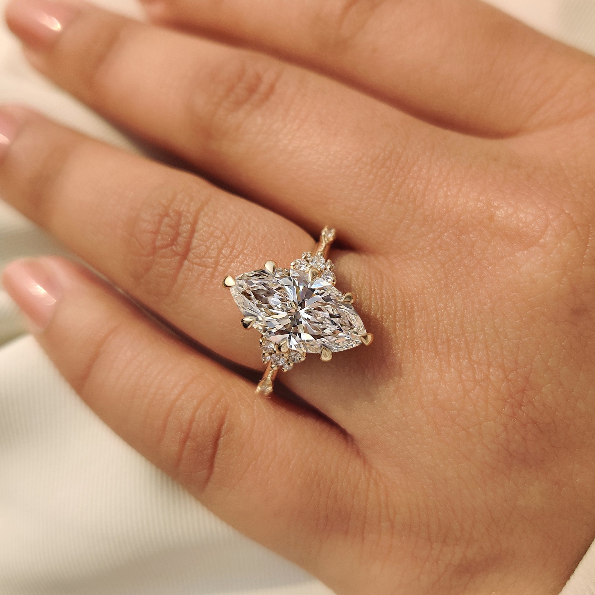 Lab grown marquise engagement ring with six claw prong
