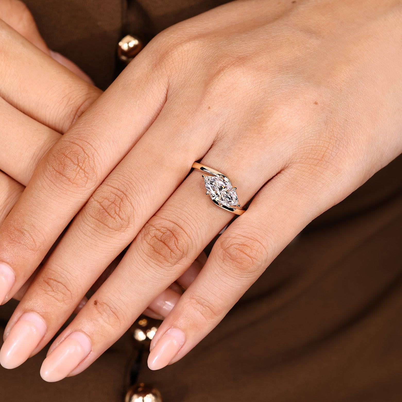 Handmade marquise solitaire ring with east west design
