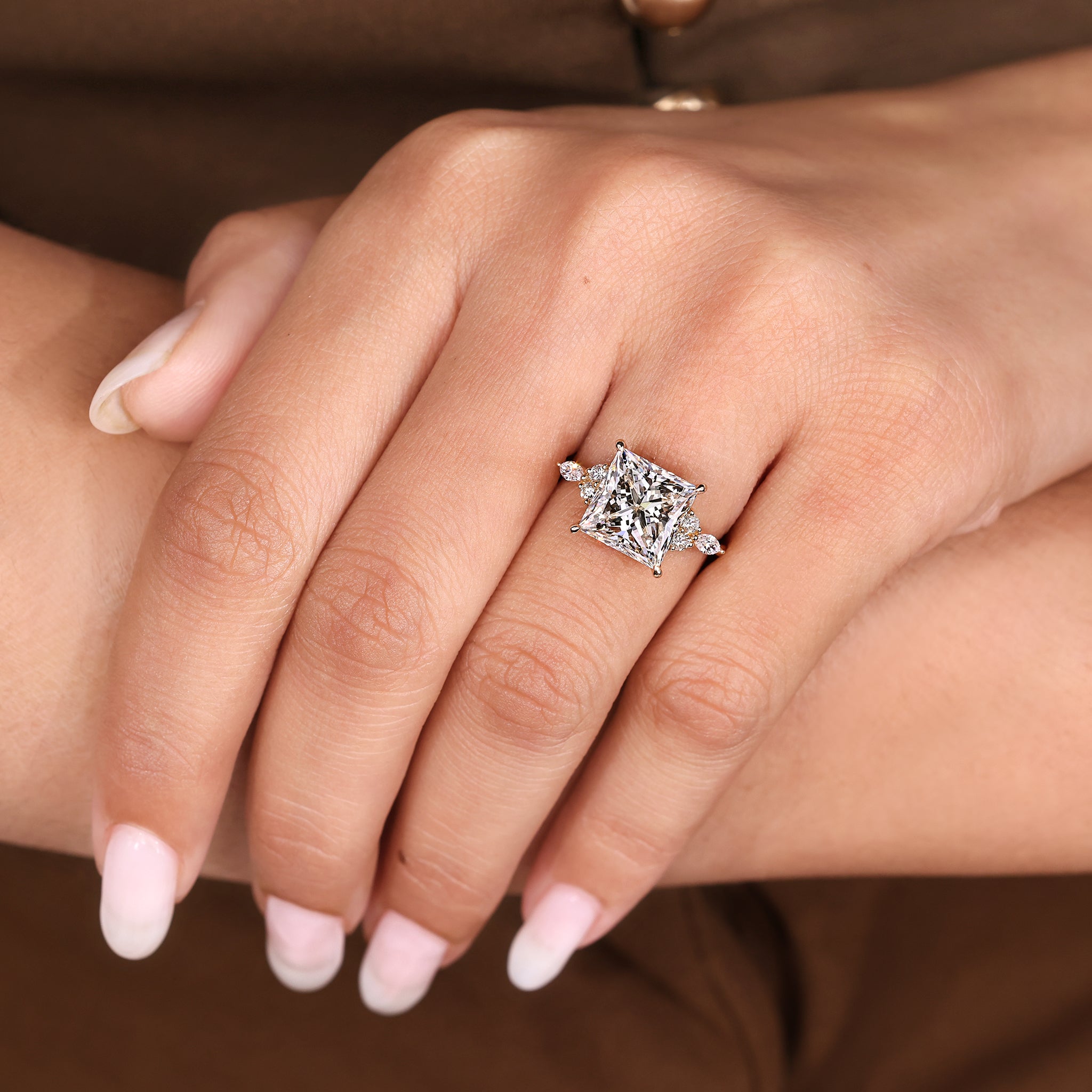 Handmade princess cut ring with marquise side stone accents.
