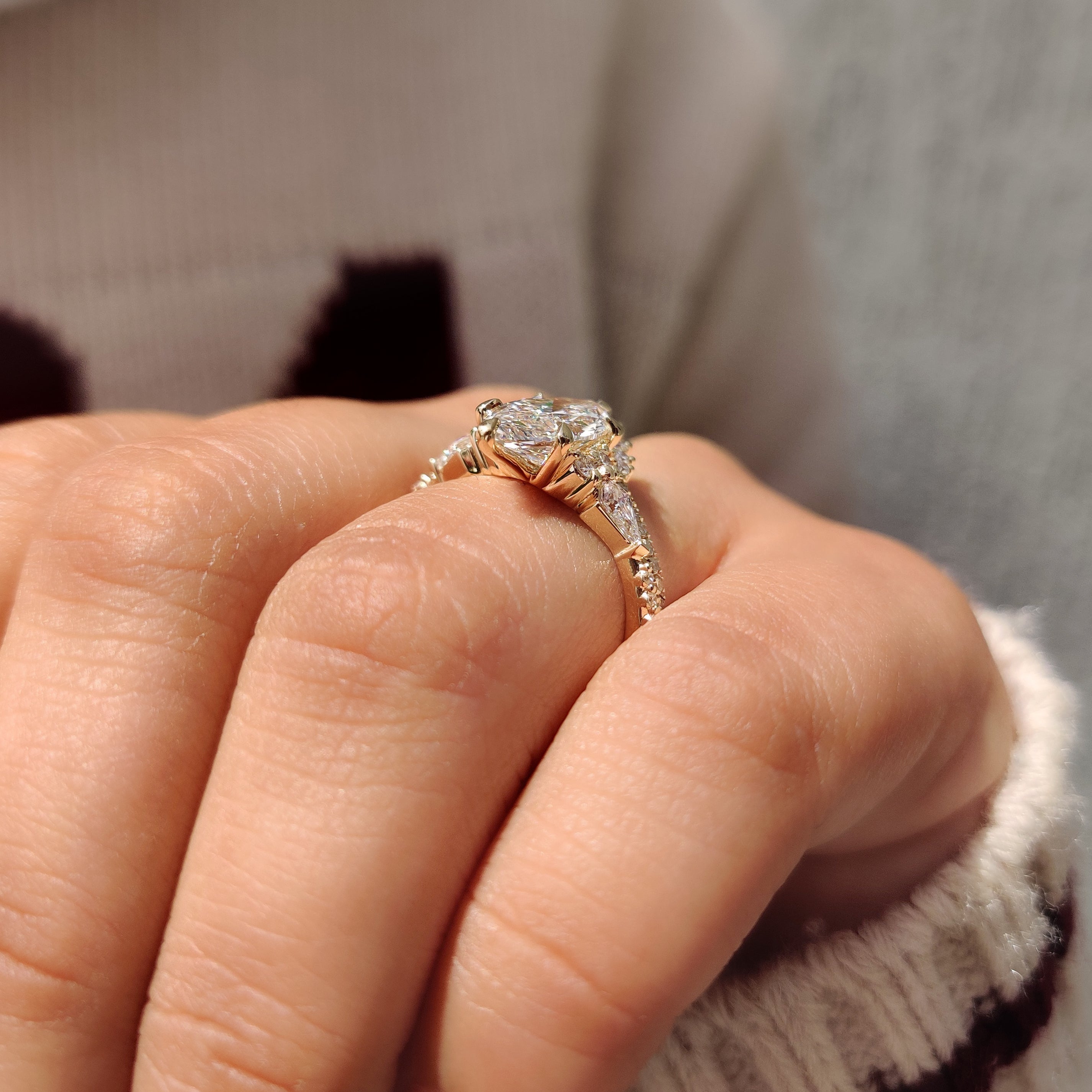 Curved wedding band with marquise engagement ring and pave.
