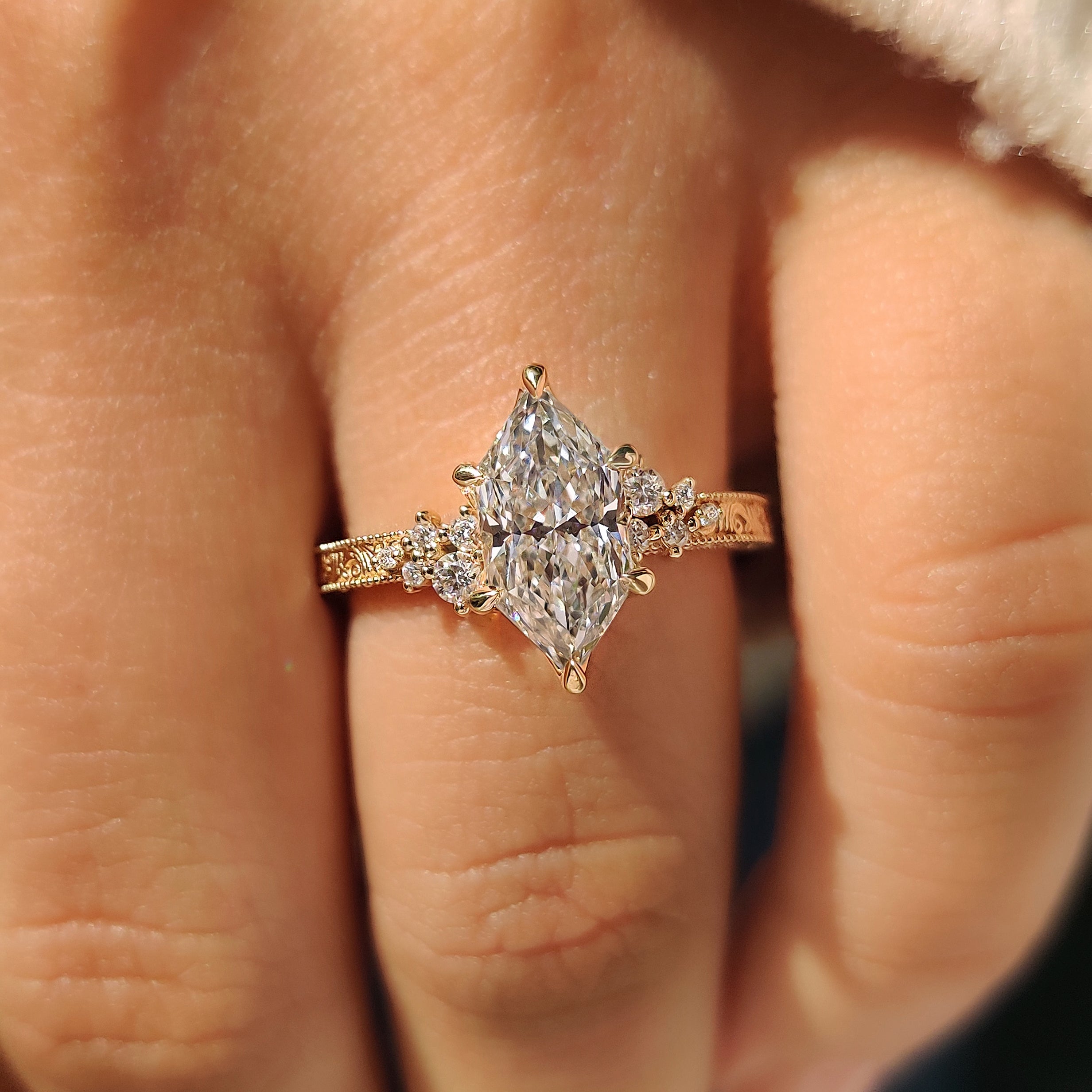 Handmade Dutch marquise ring with round side stone accents
