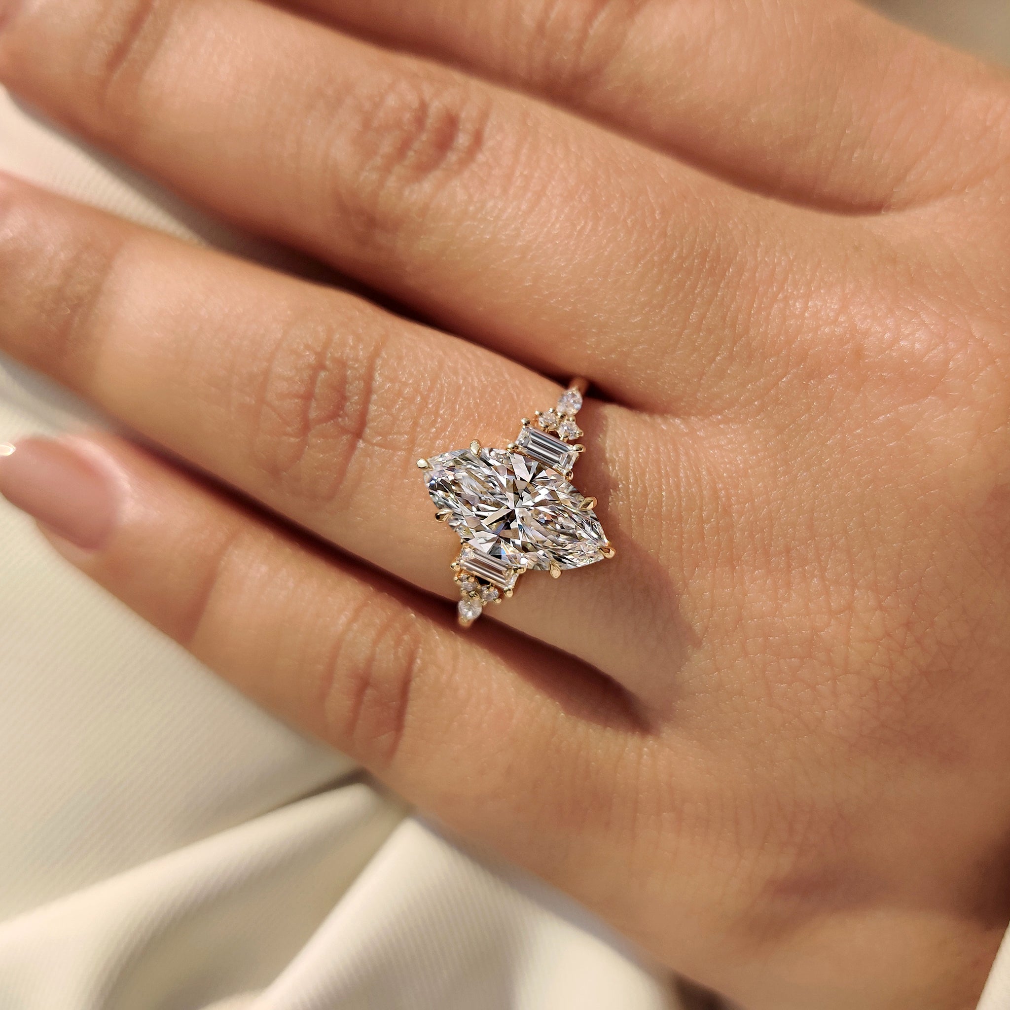 Marquise engagement ring with basket setting design.
