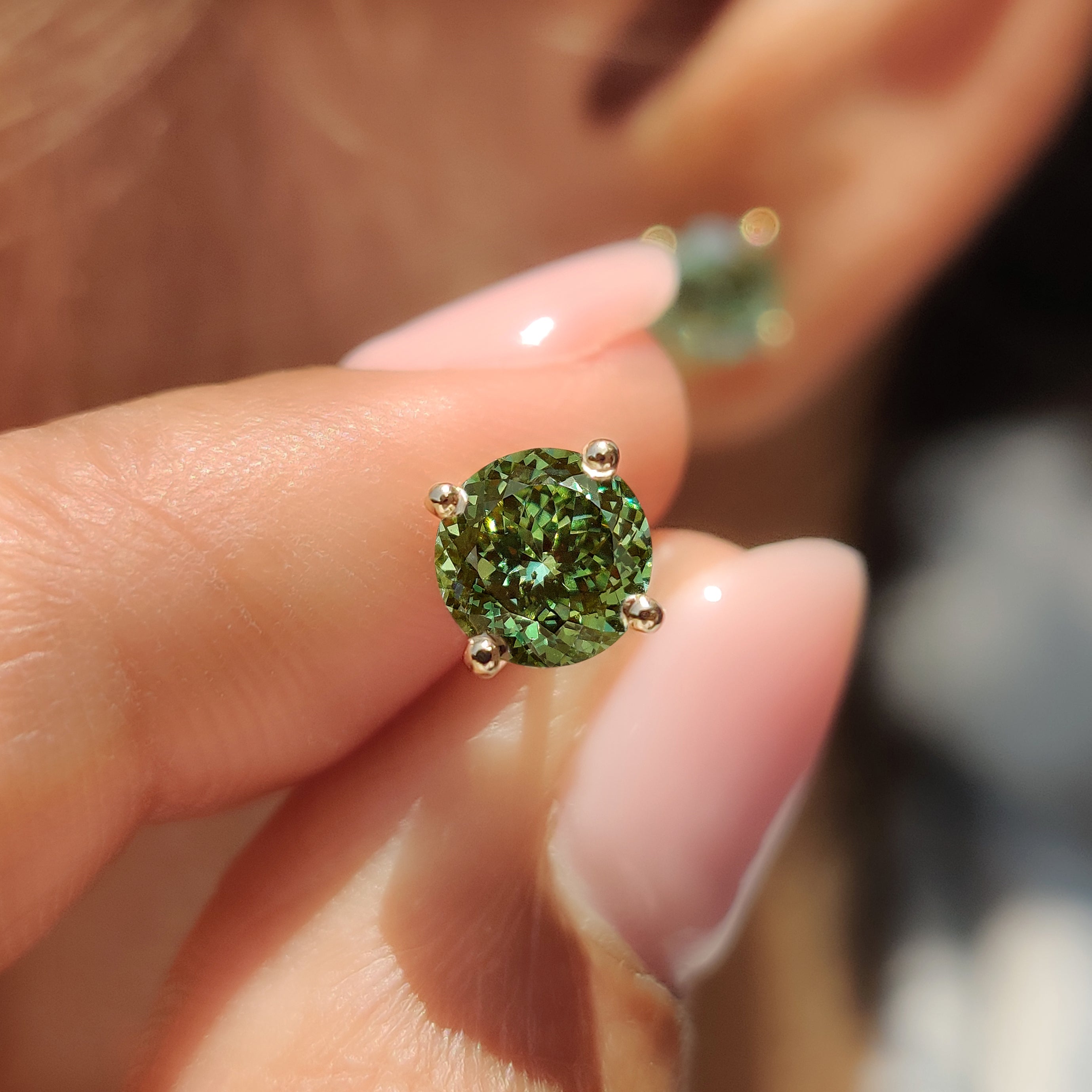 Portuguese cut stud earrings featuring lab grown green diamonds

