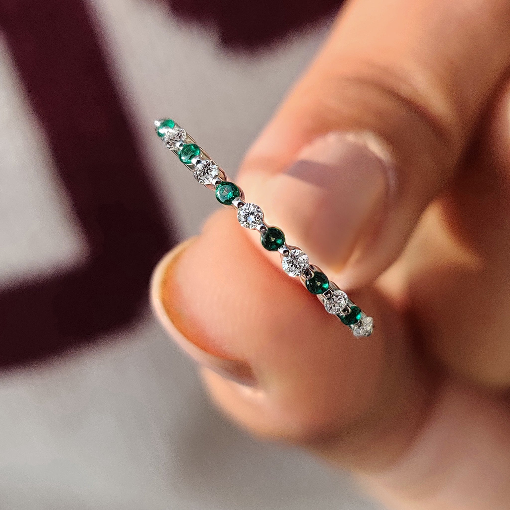 Handmade half eternity band with diamond and emerald stones.
