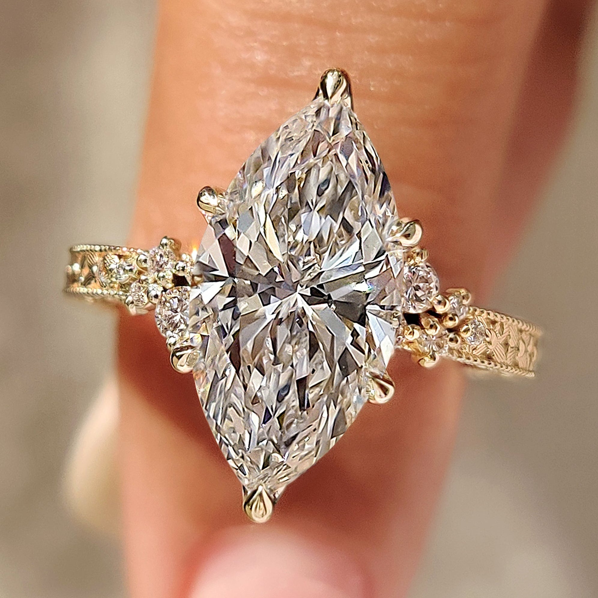 Vintage marquise cut diamond ring with milgrain details
