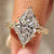 Vintage marquise cut diamond ring with milgrain details
