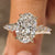 Oval cut center diamond with marquise side stones
