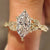 Dutch marquise engagement ring with leaf and vine shank
