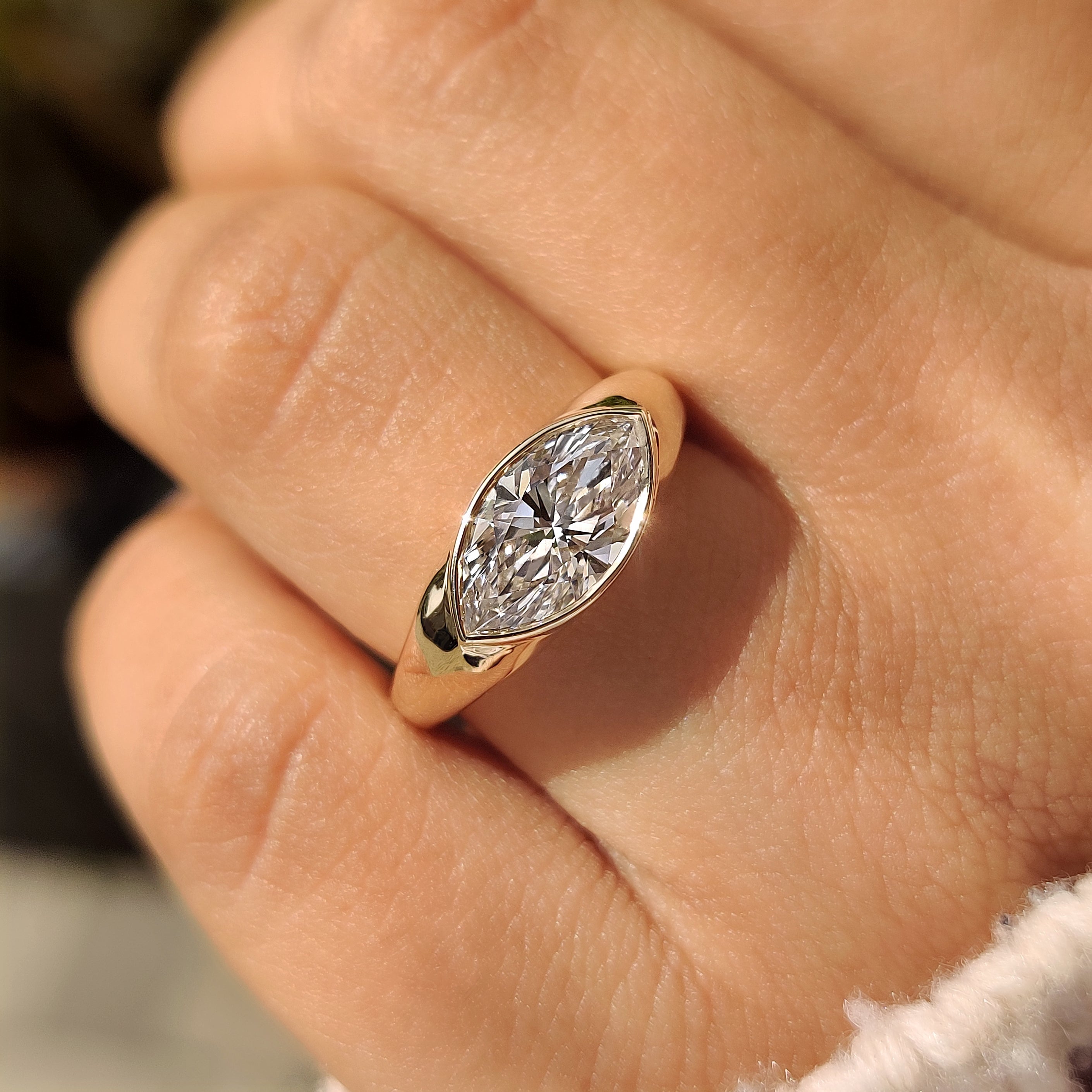 Marquise center diamond in east west setting
