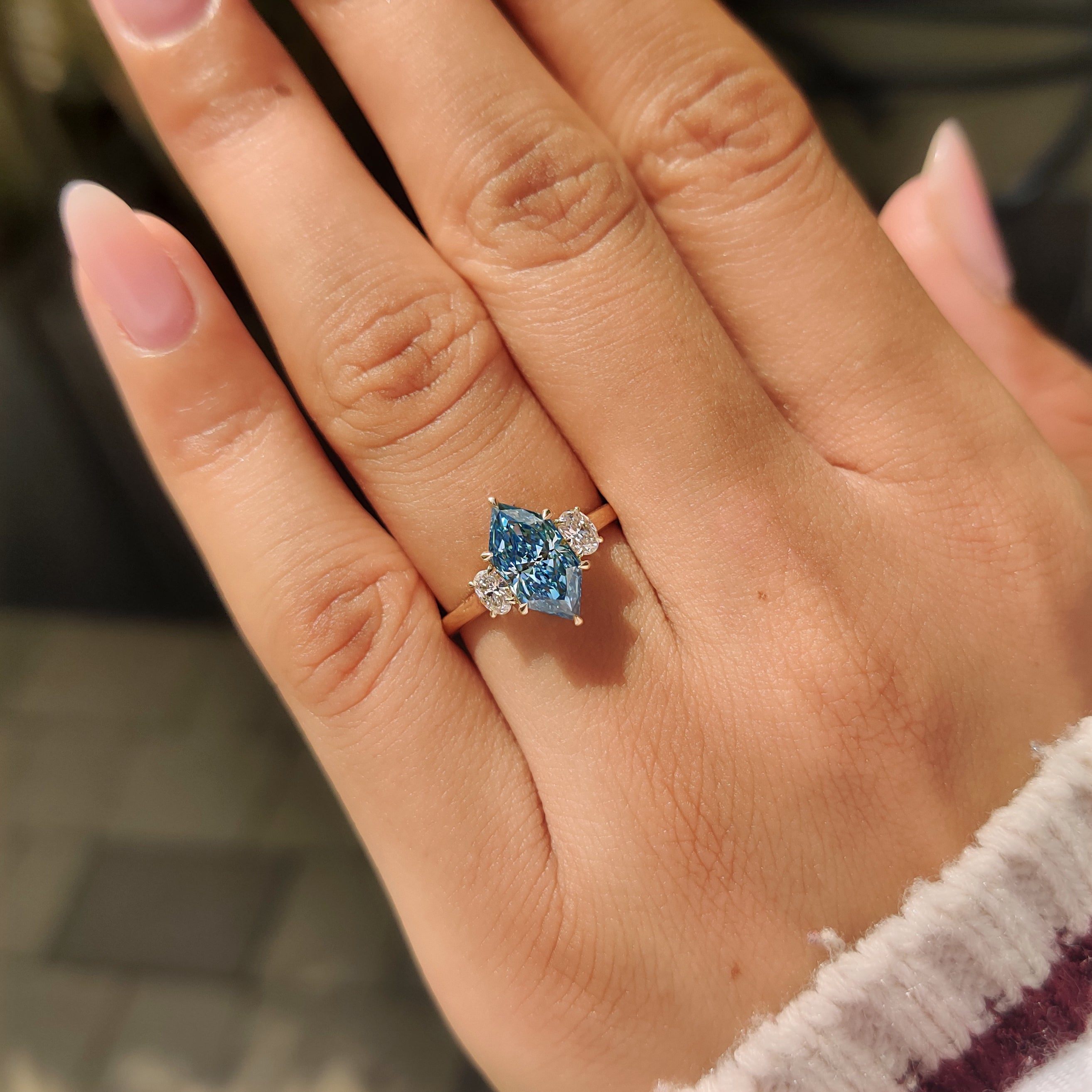 Three stone engagement ring with basket setting.
