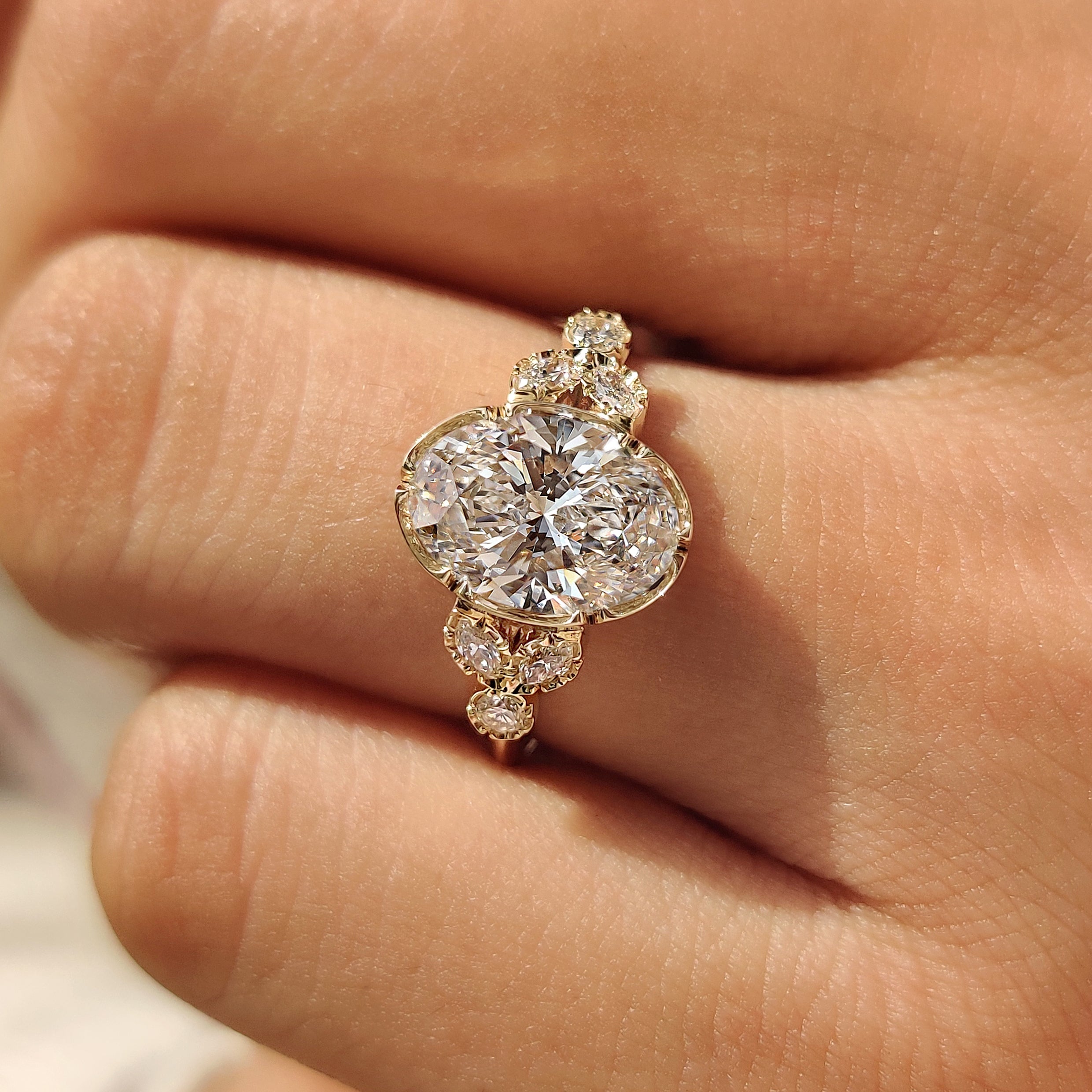 Seven stone oval ring with muse setting
