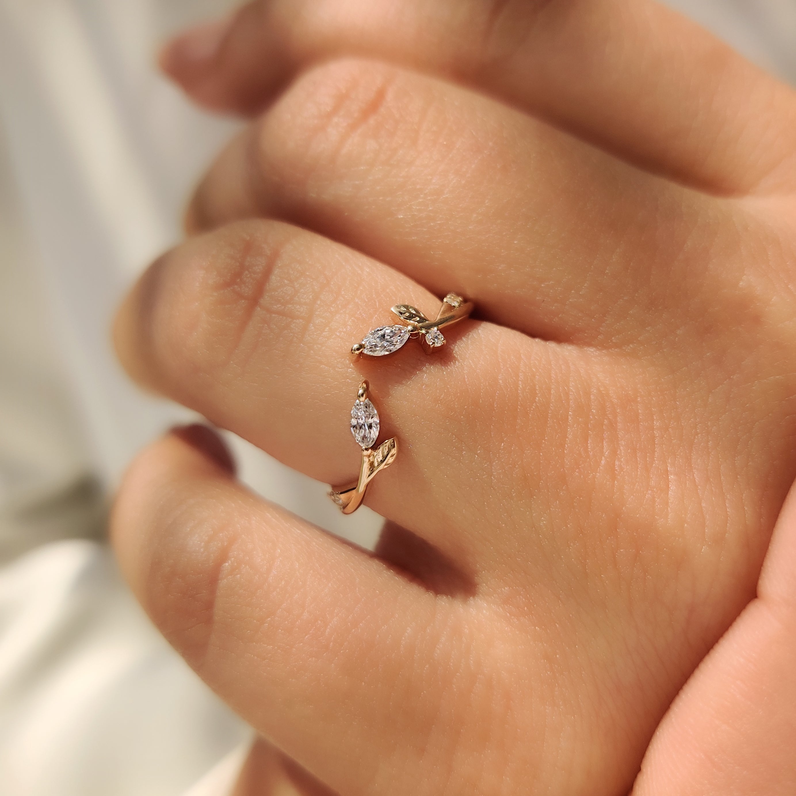 Lab grown diamond wedding band with leaf inspired details.
