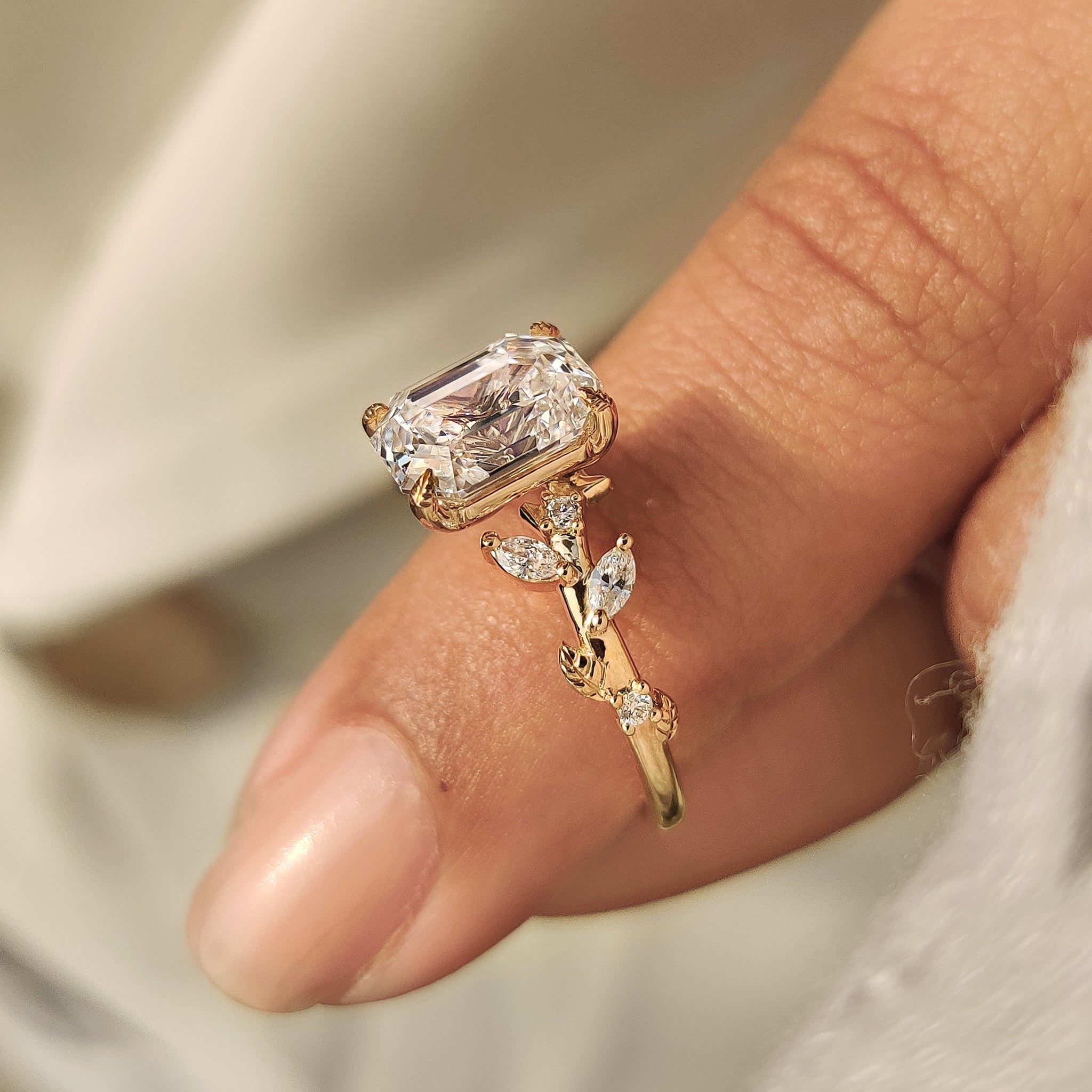 Nature inspired ring by Carat Diamonds with side stones
