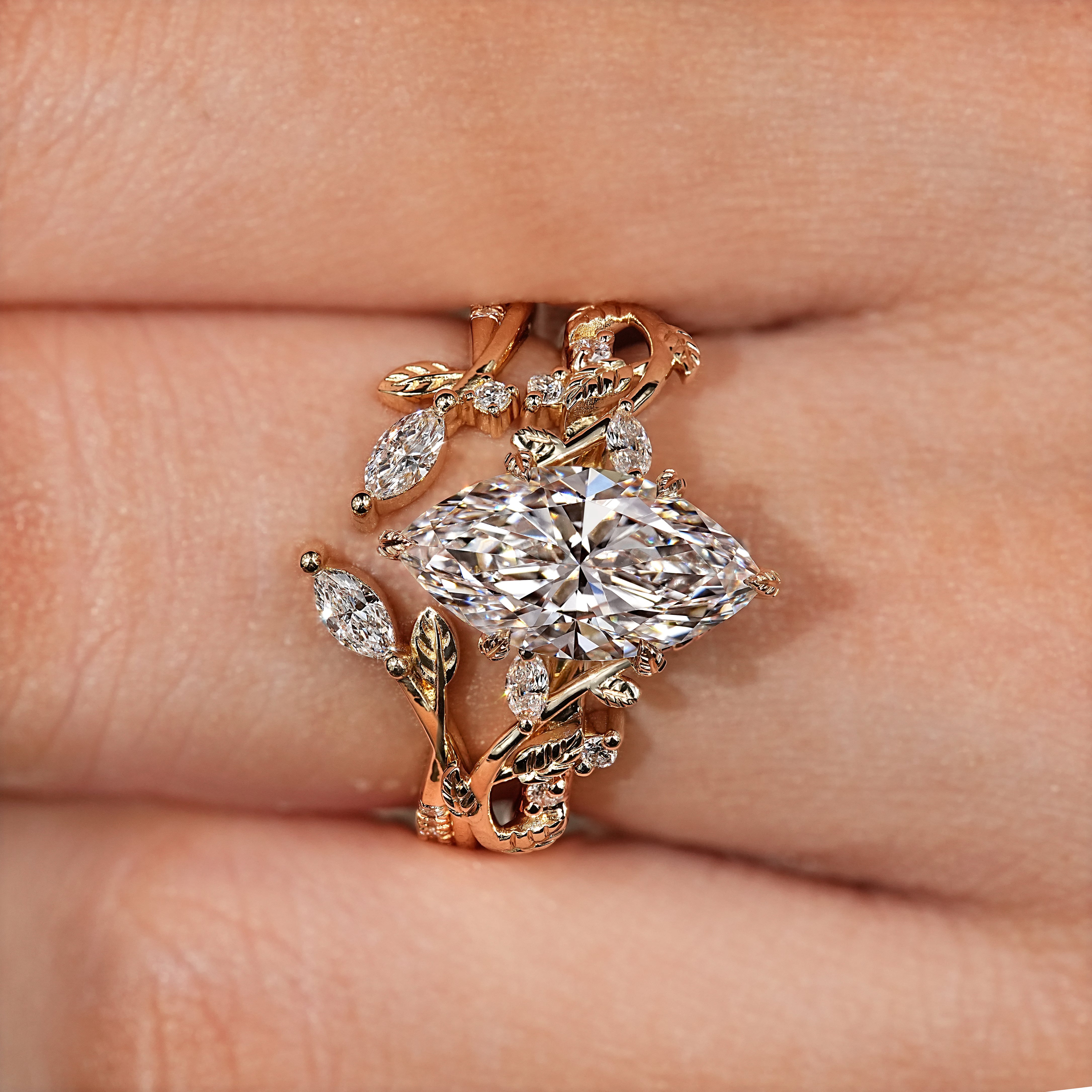 Leaf style band paired with marquise engagement ring
