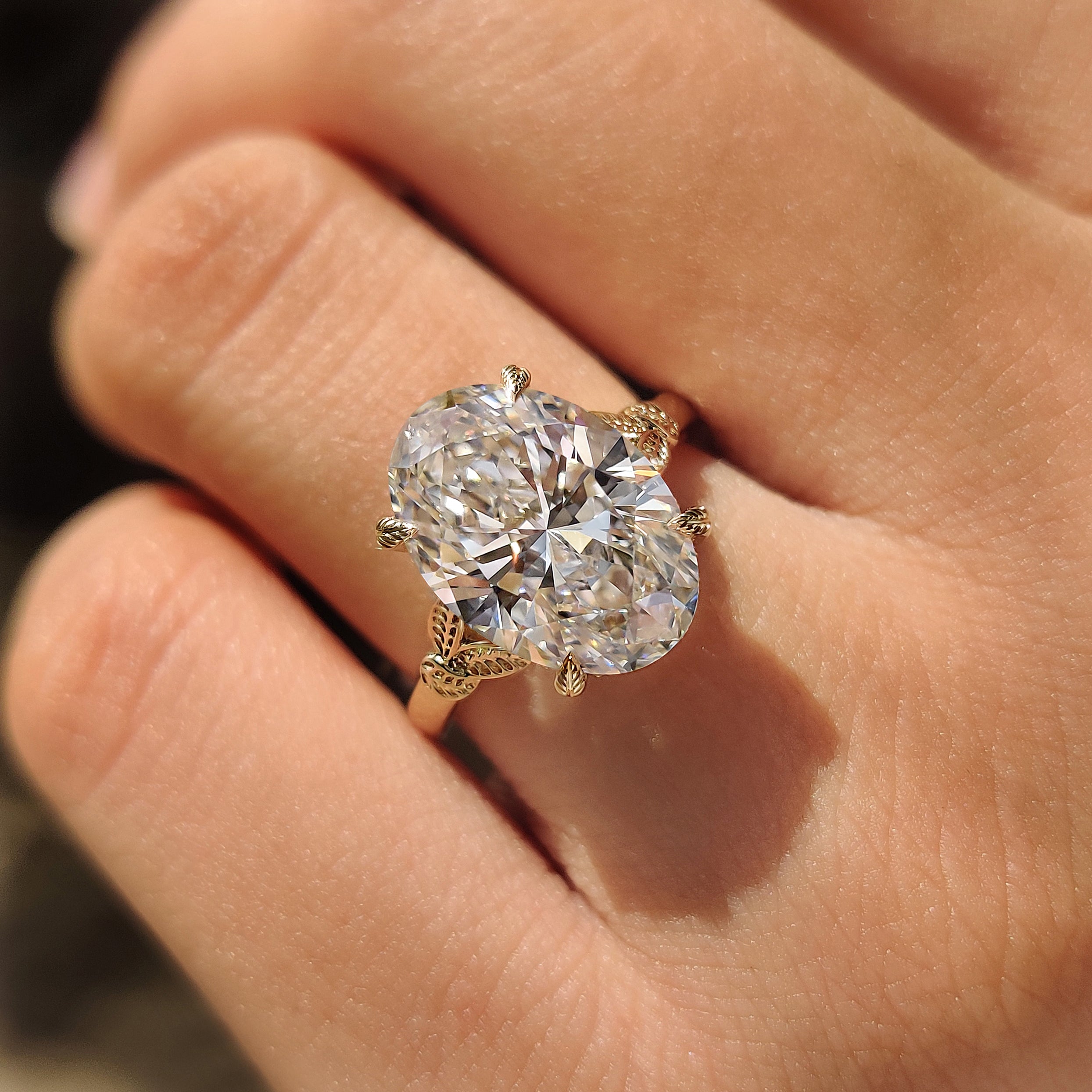 Oval diamond ring with hidden round halo

