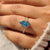 Lab grown marquise diamond ring with round side stones
