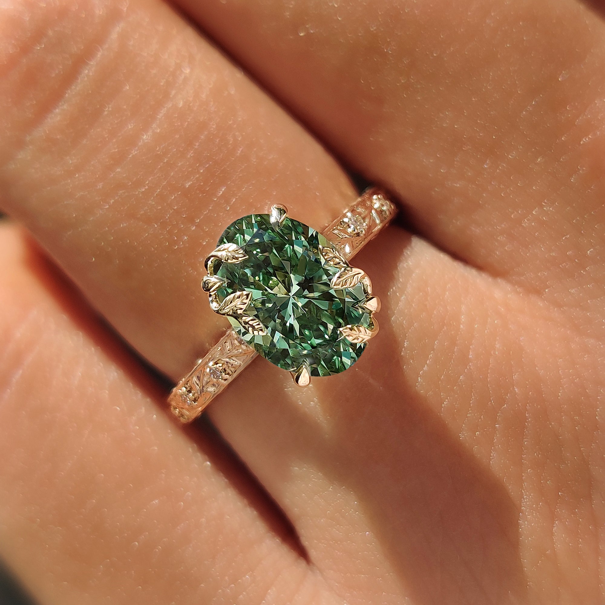 IGI certified green oval diamond set in handmade ring.
