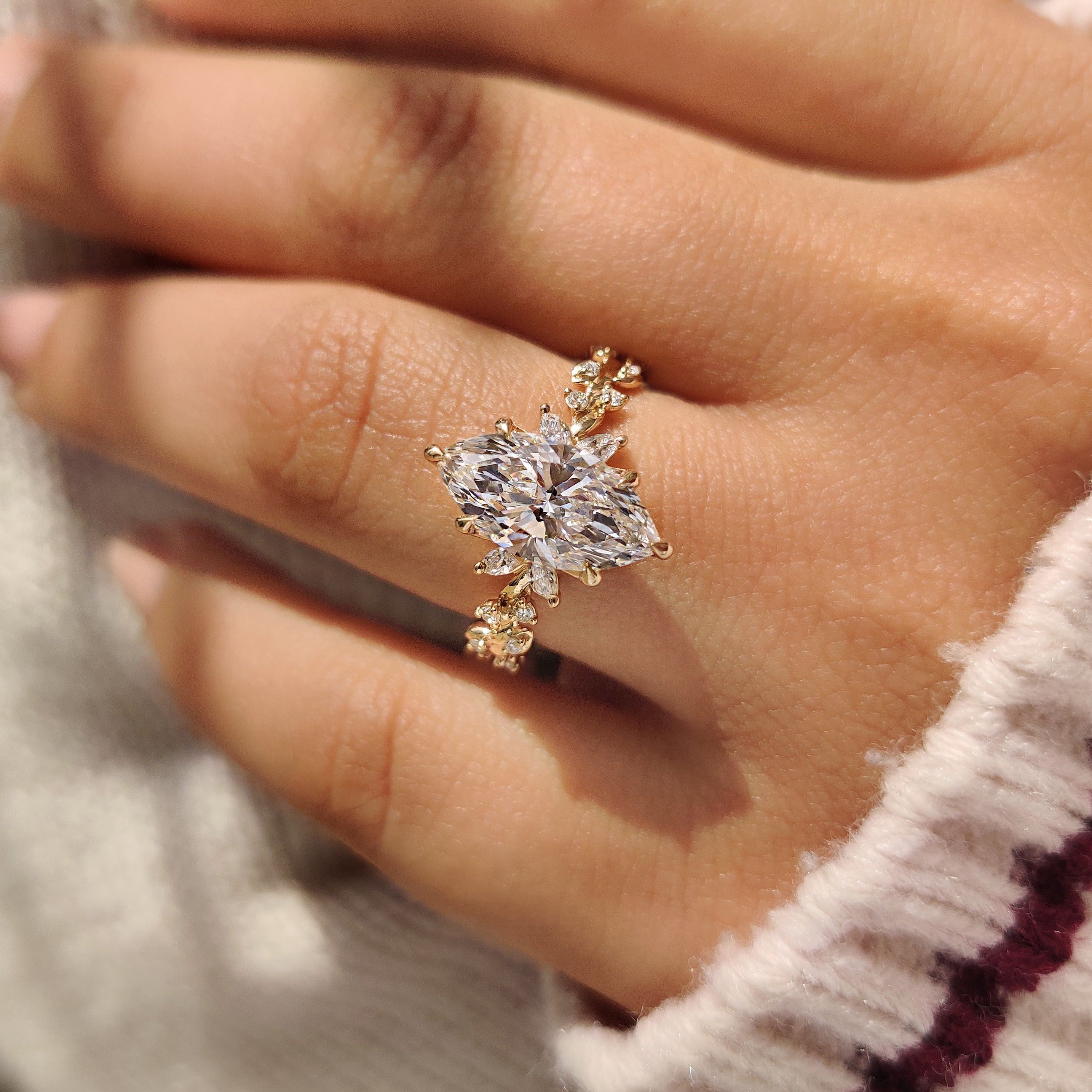 Handmade marquise ring with round and marquise side stones.
