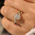 Nature style oval diamond ring with four leaf prongs.

